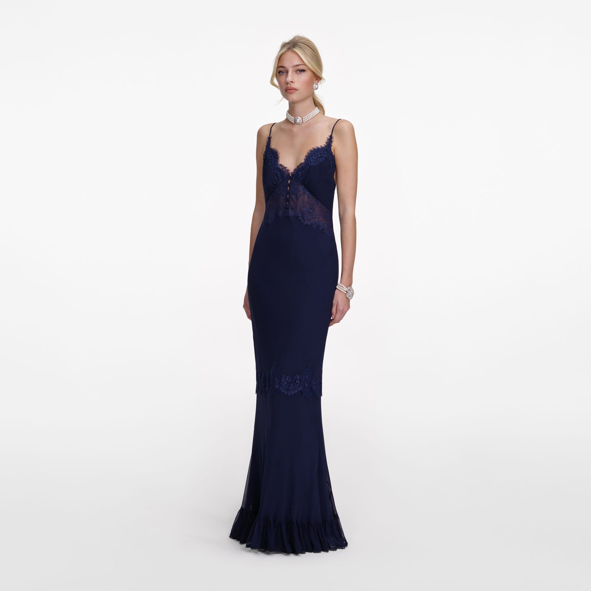 Side view of a woman wearing the Navy Lace Georgette Maxi Dress