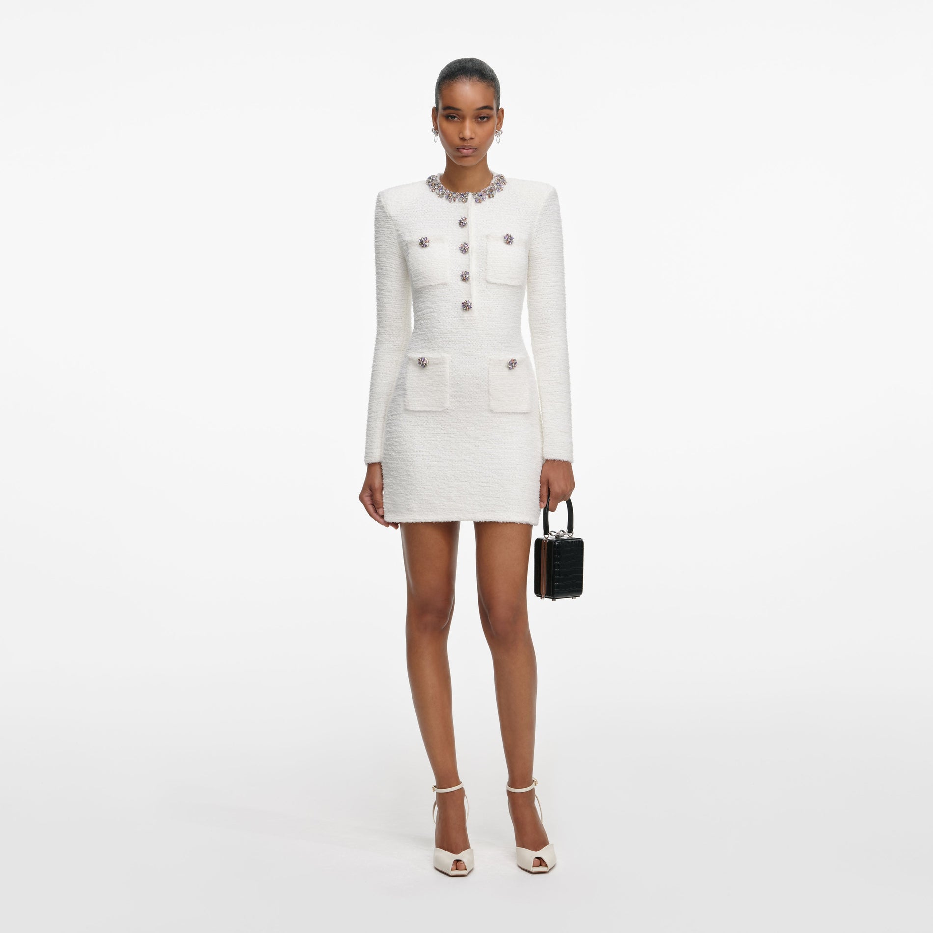 Front view of a woman wearing the Cream Crystal Trim Knit Mini Dress