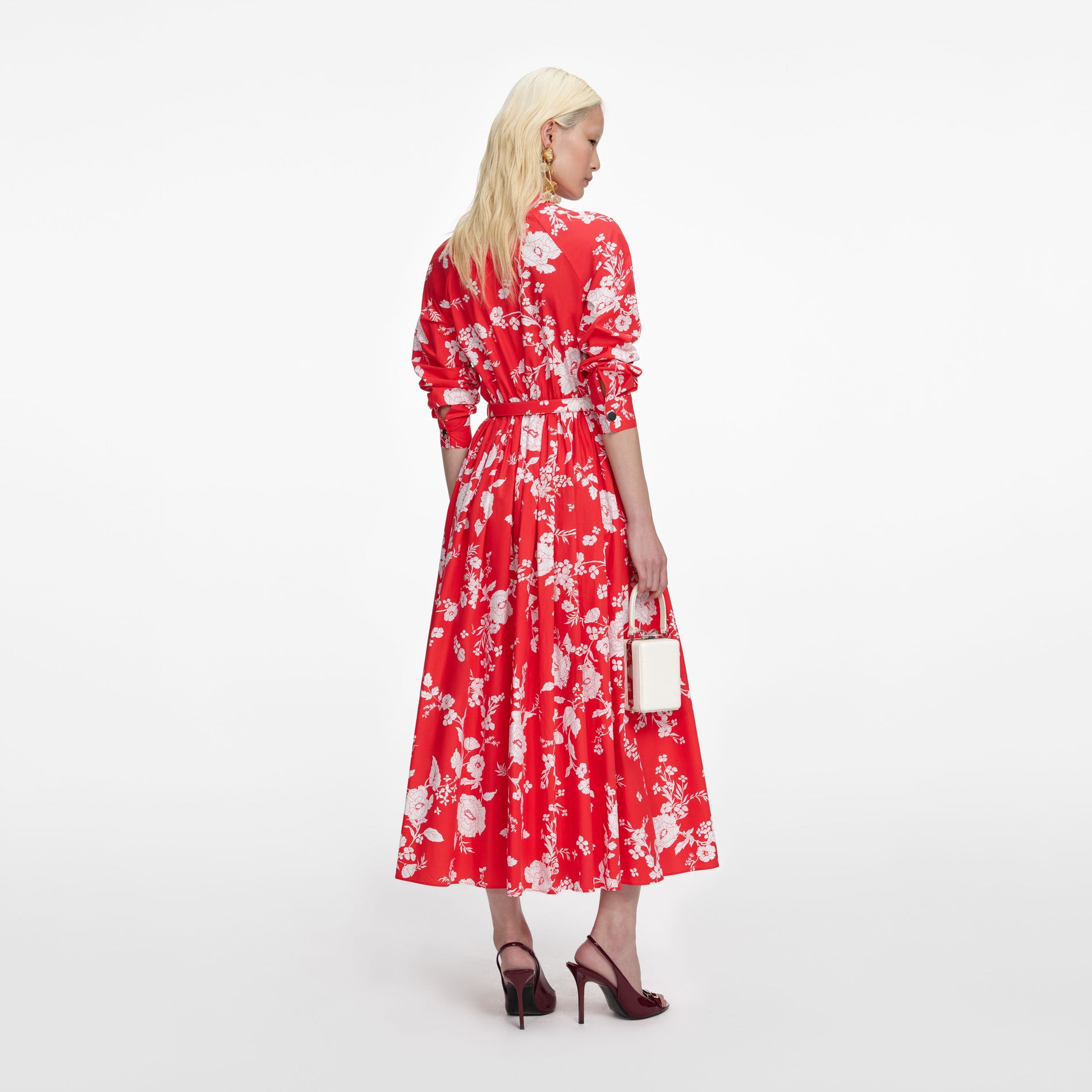 Back view of a woman wearing the Red Floral Cotton Midi Dress