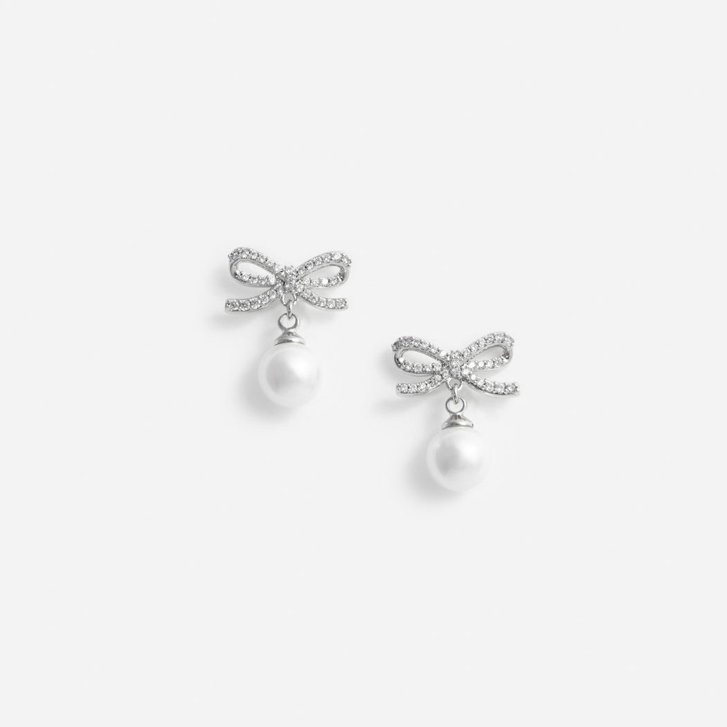 Pair of silver bow earrings with pearl drops