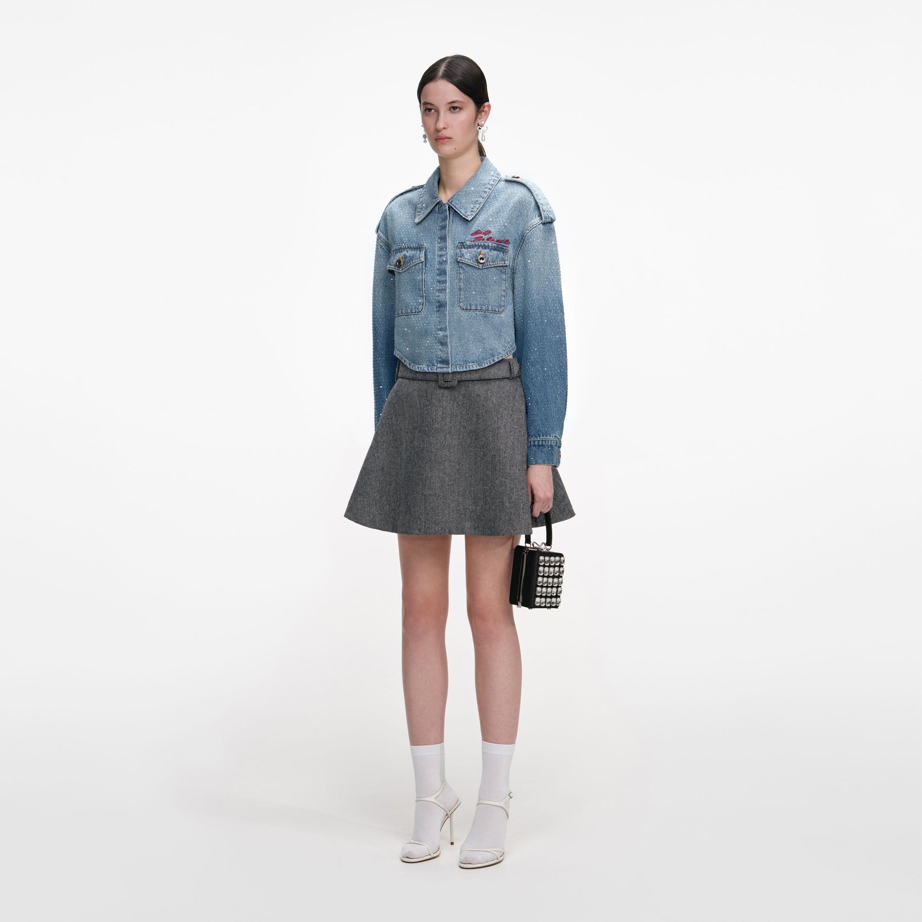 A close up of a woman wearing the Rhinestone Denim Shirt