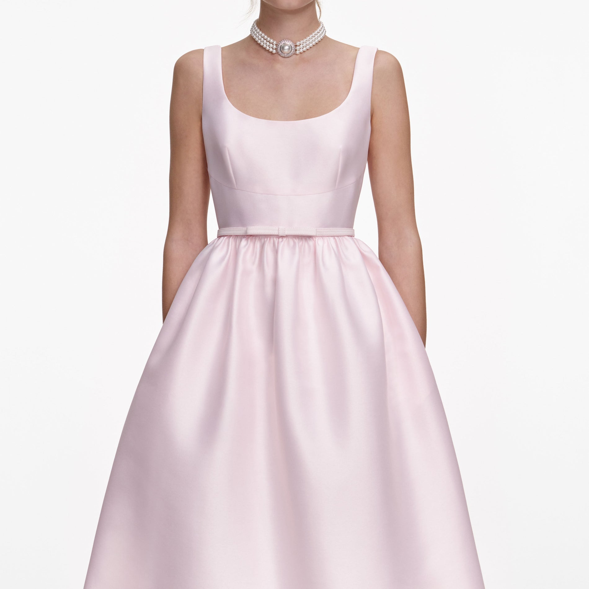 A close up of a woman wearing the Pink Taffeta Midi Dress