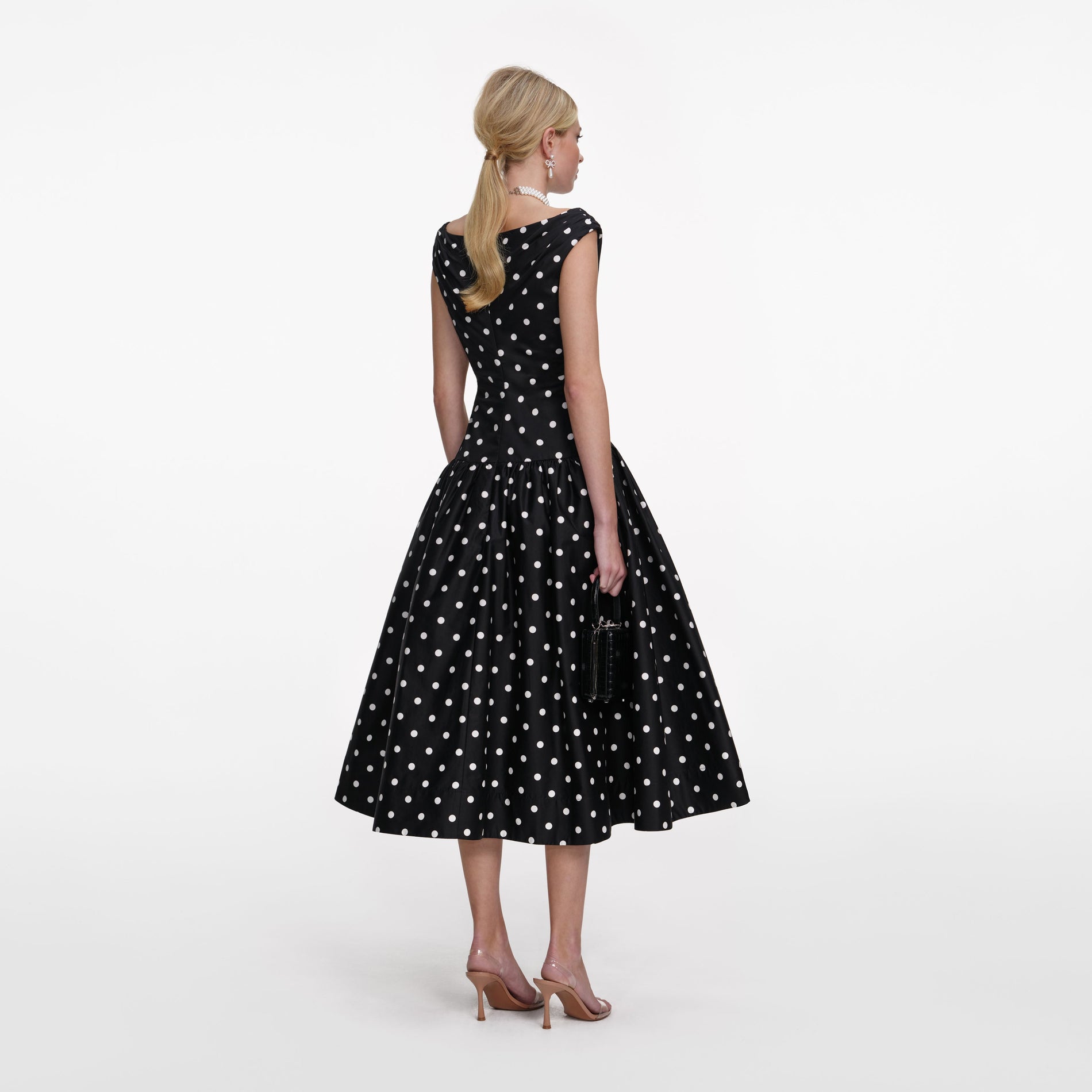 Back view of a woman wearing the Black Cotton Midi Dress