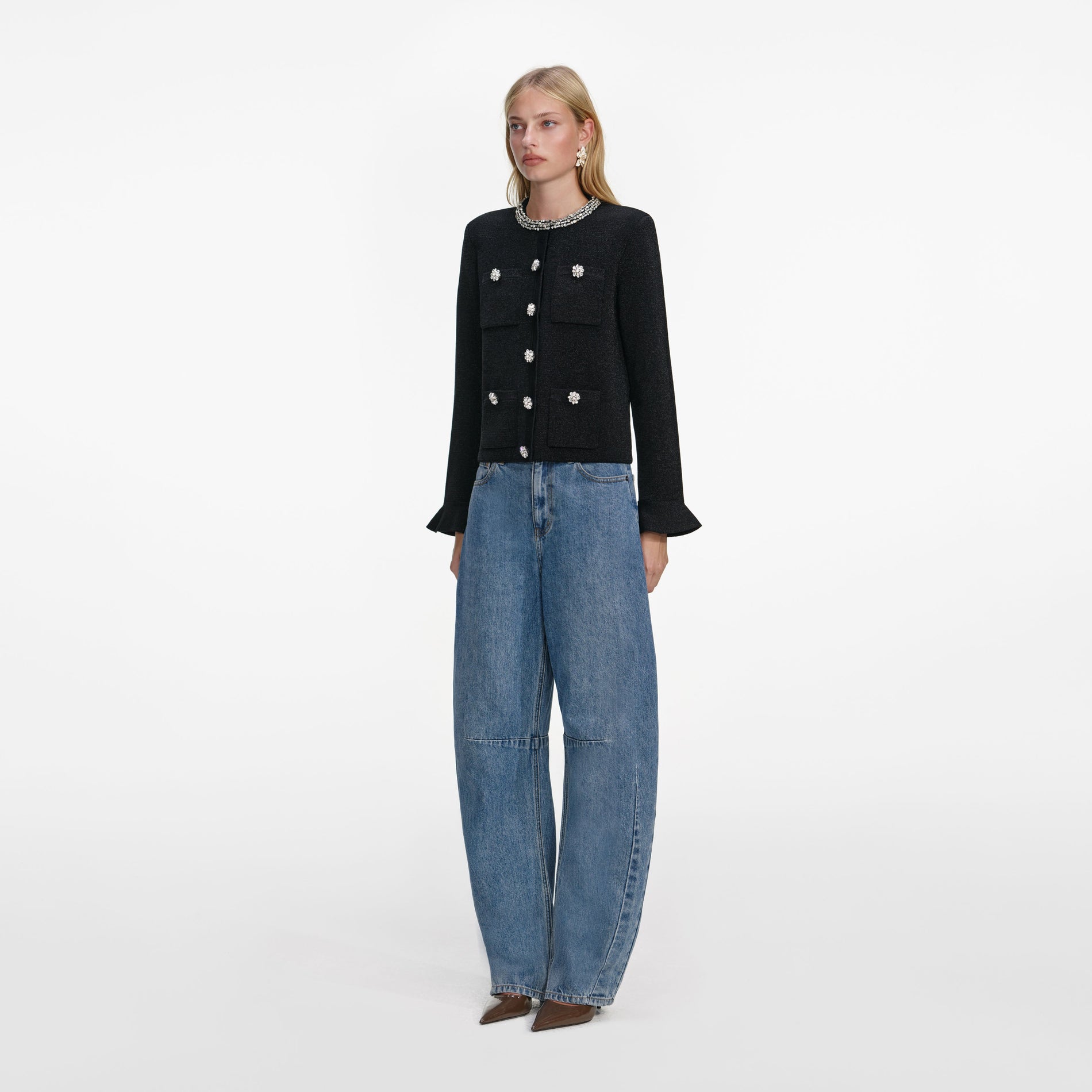 Side view of a woman wearing the Black Crystal Button Cardigan