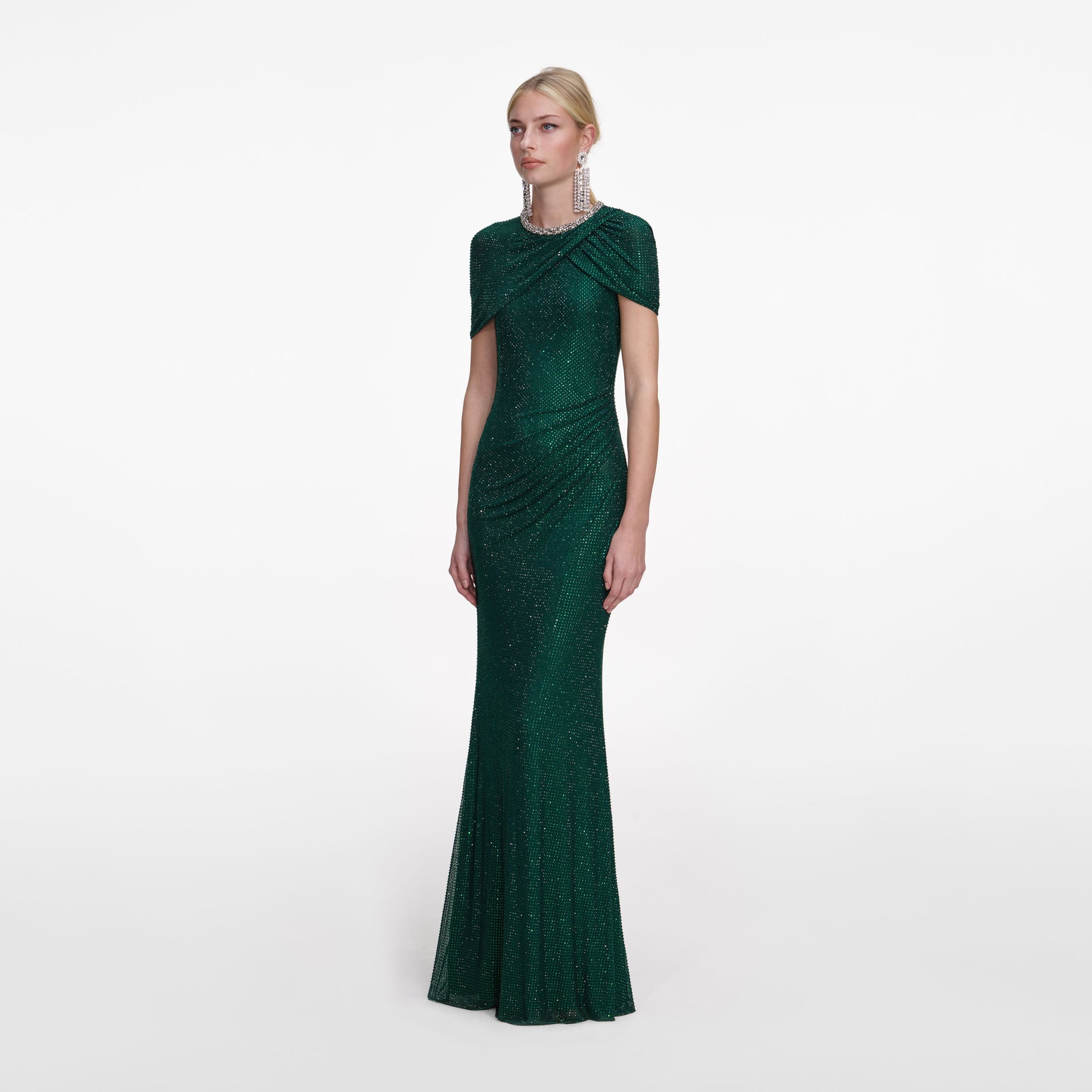 Side view of a woman wearing the Green Rhinestone Maxi Dress