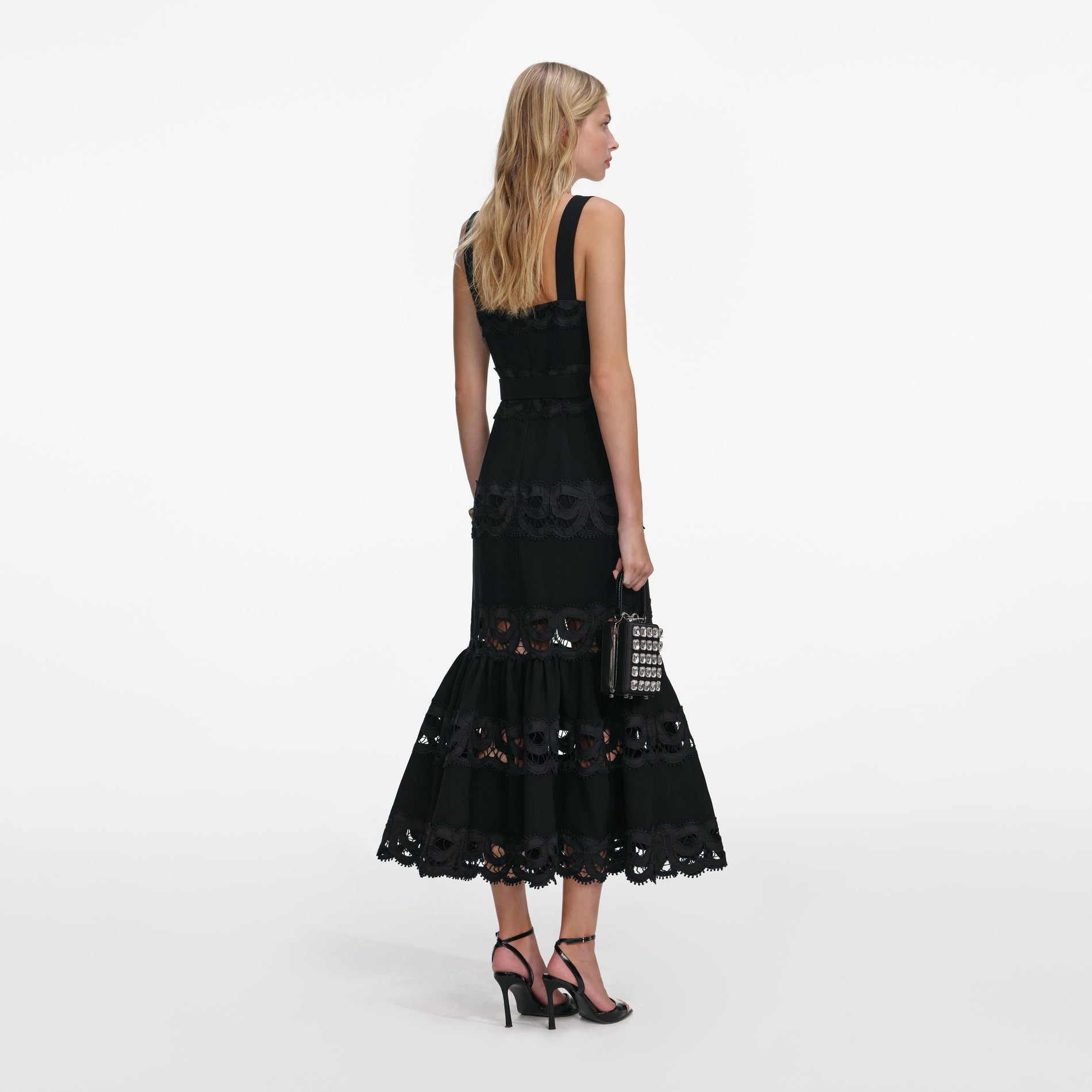 Back view of a woman wearing the Black Crepe Midi Dress