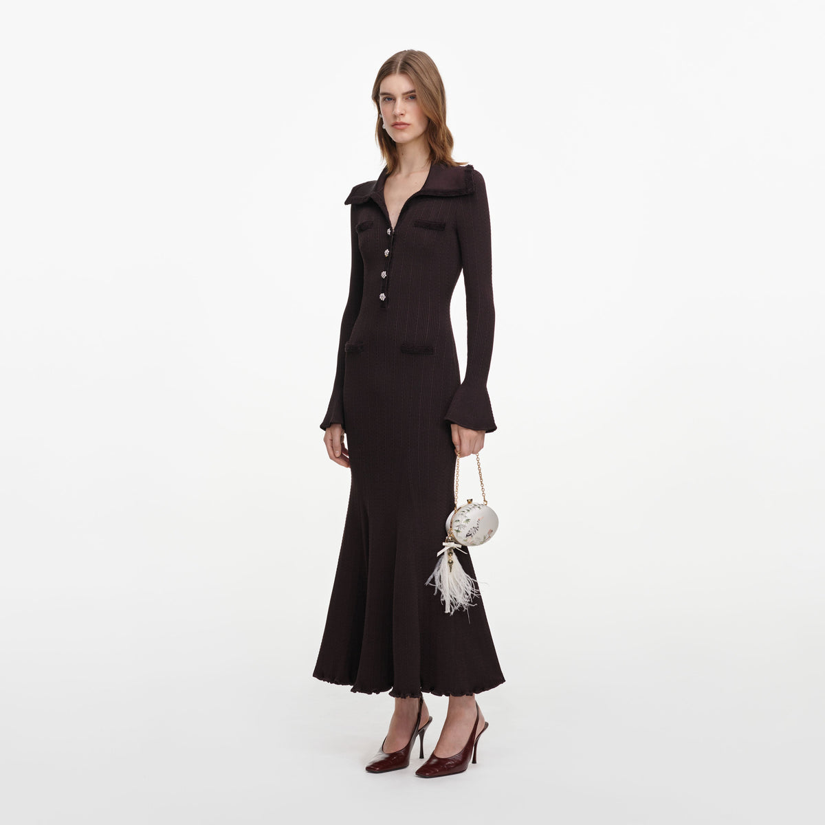 Side view of a woman wearing the Brown Fringe Knit Midi Dress