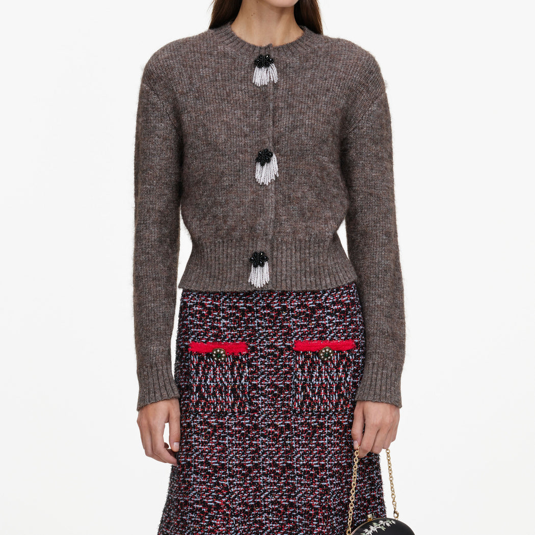 A close up of a woman wearing the Brown Fluffy Knit Cardigan