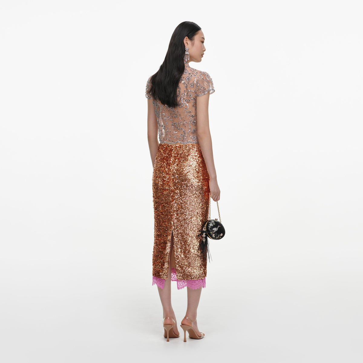 Back view of a woman wearing the Silver Sequin Embellished Top