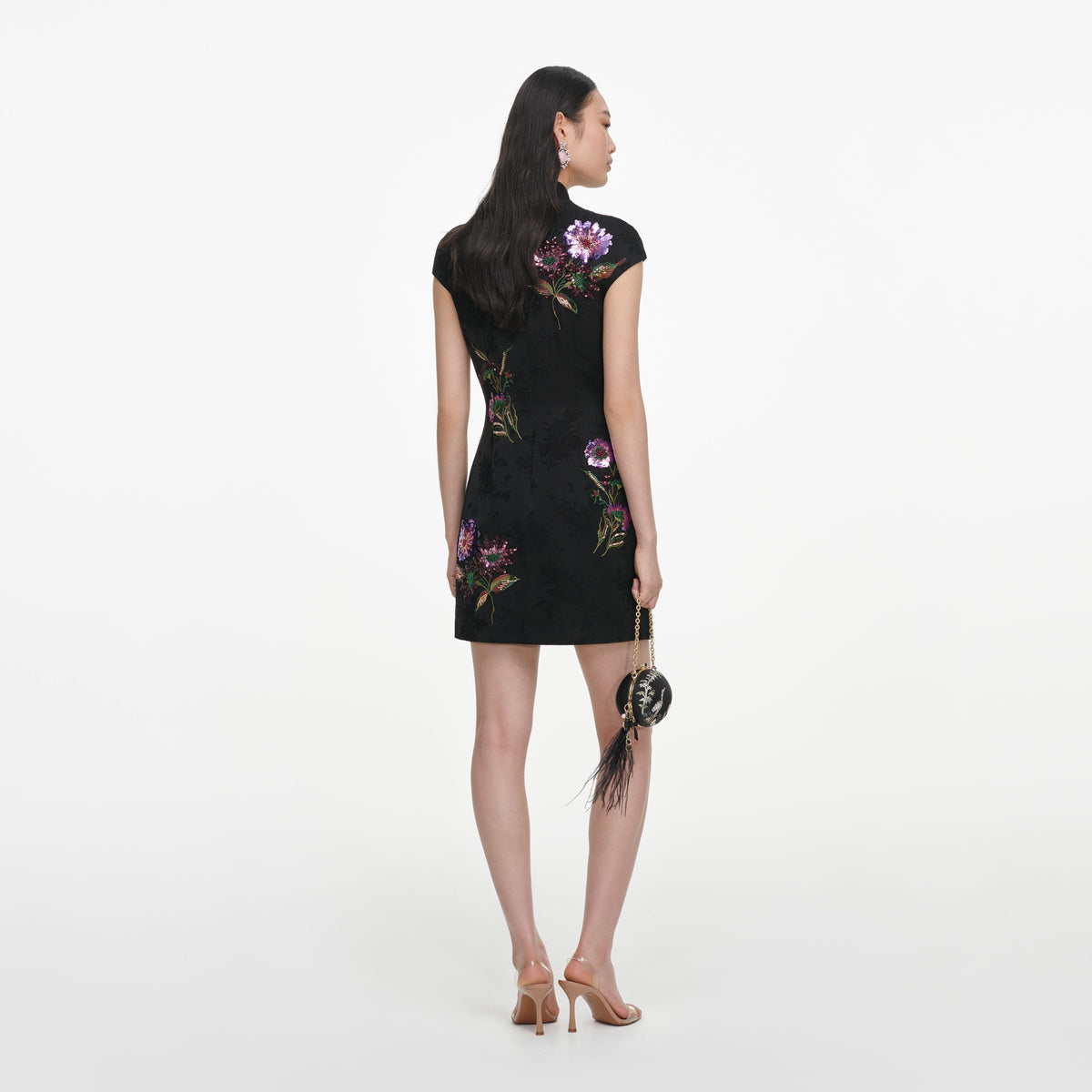 Back view of a woman wearing the Black Jacquard Sequin Embroidered Mini Dress
