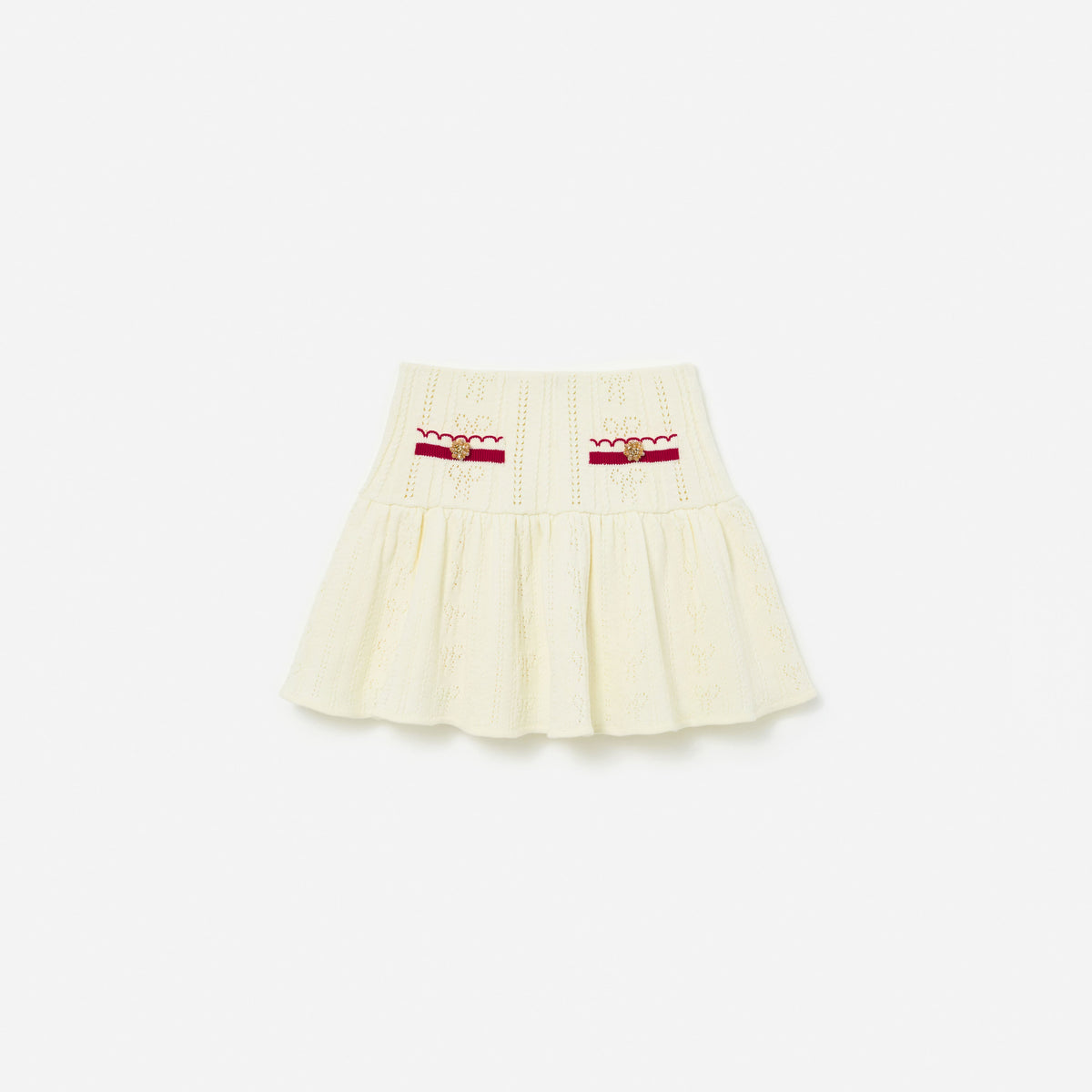 Front view of a girl wearing the Cream Pointelle Knit Stripe Skirt