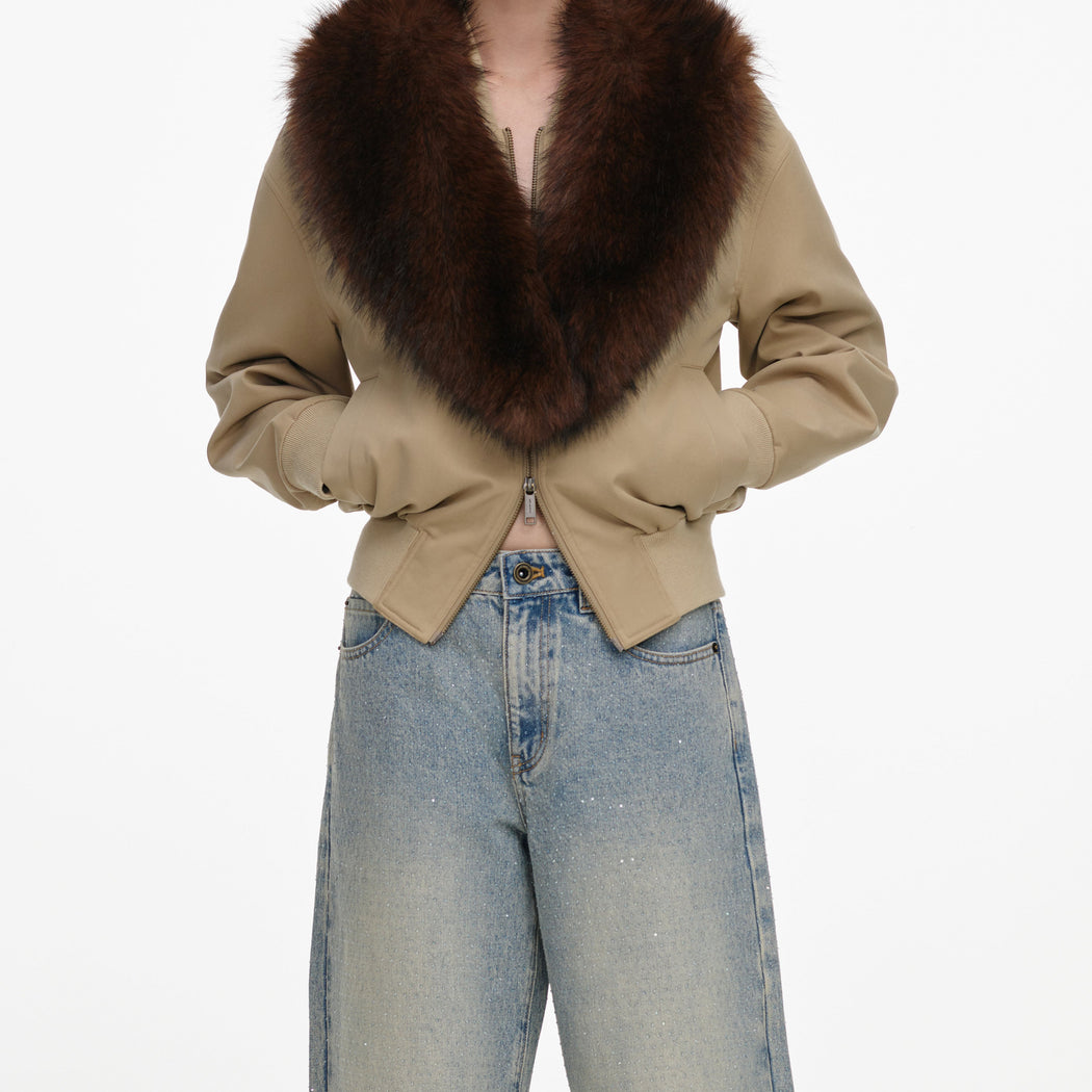 A close up of a woman wearing the Bleached Wash Jeans