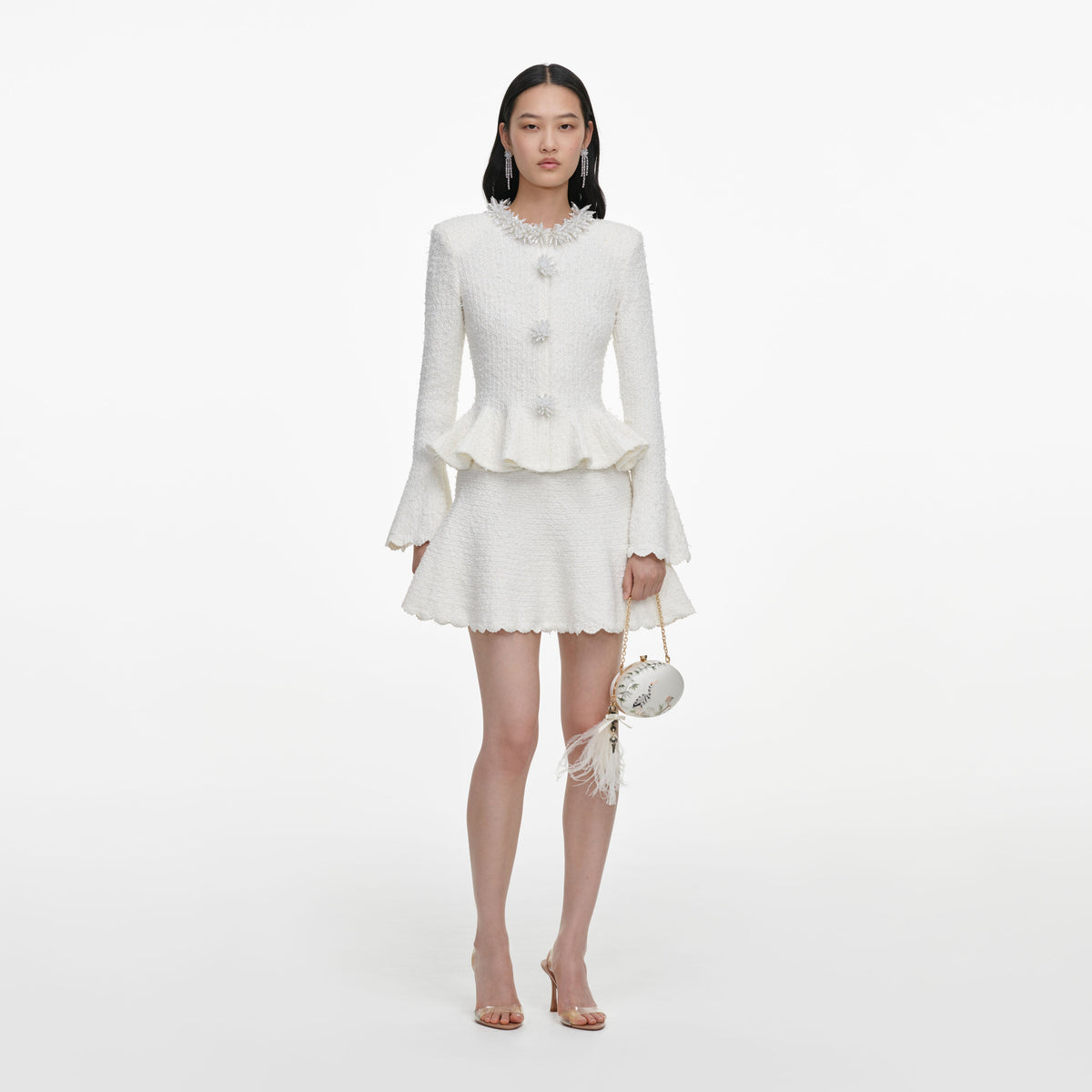 Front view of a woman wearing the White Textured Knit Mini Dress