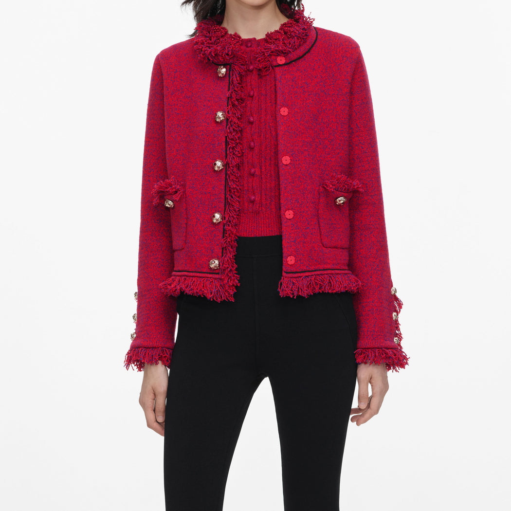 A close up of a woman wearing the Red Frayed Knit Jacket