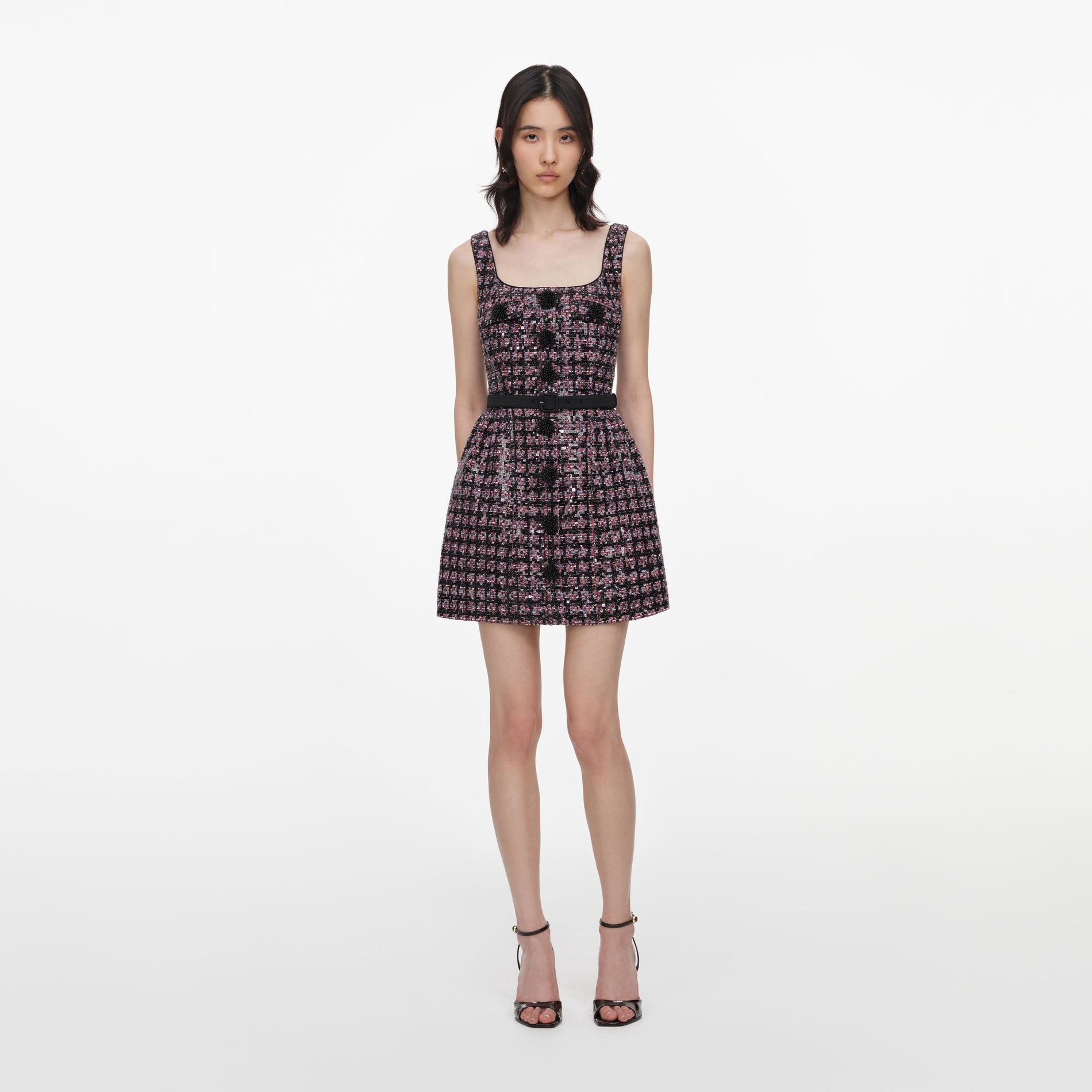 Front view of a woman wearing the Pink and Black Sequin Boucle Sleeveless Mini Dress