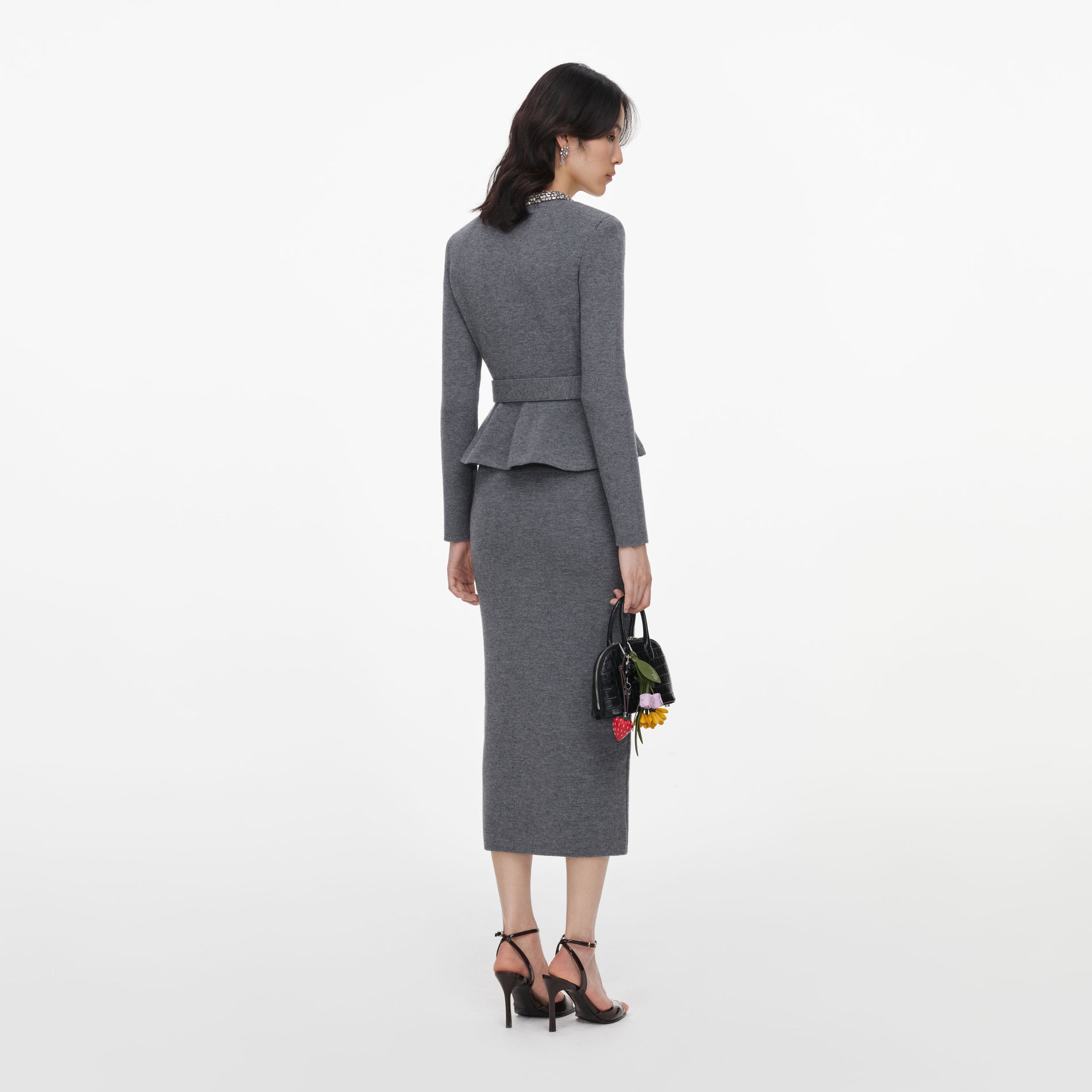 Back view of a woman wearing the Grey Crystal Trim Knit Midi Dress