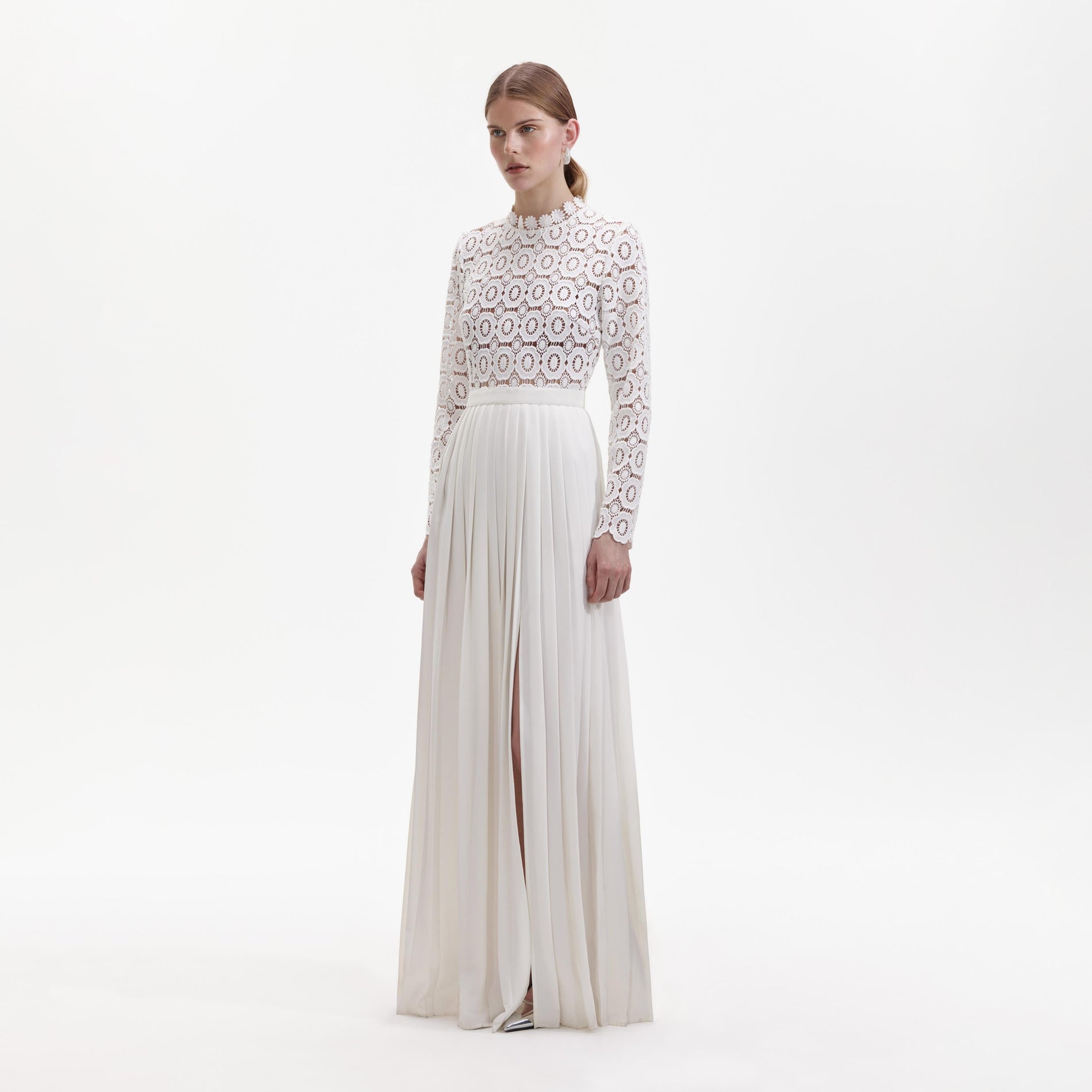 Side view of a woman wearing the Pleated Crochet Floral Maxi Dress