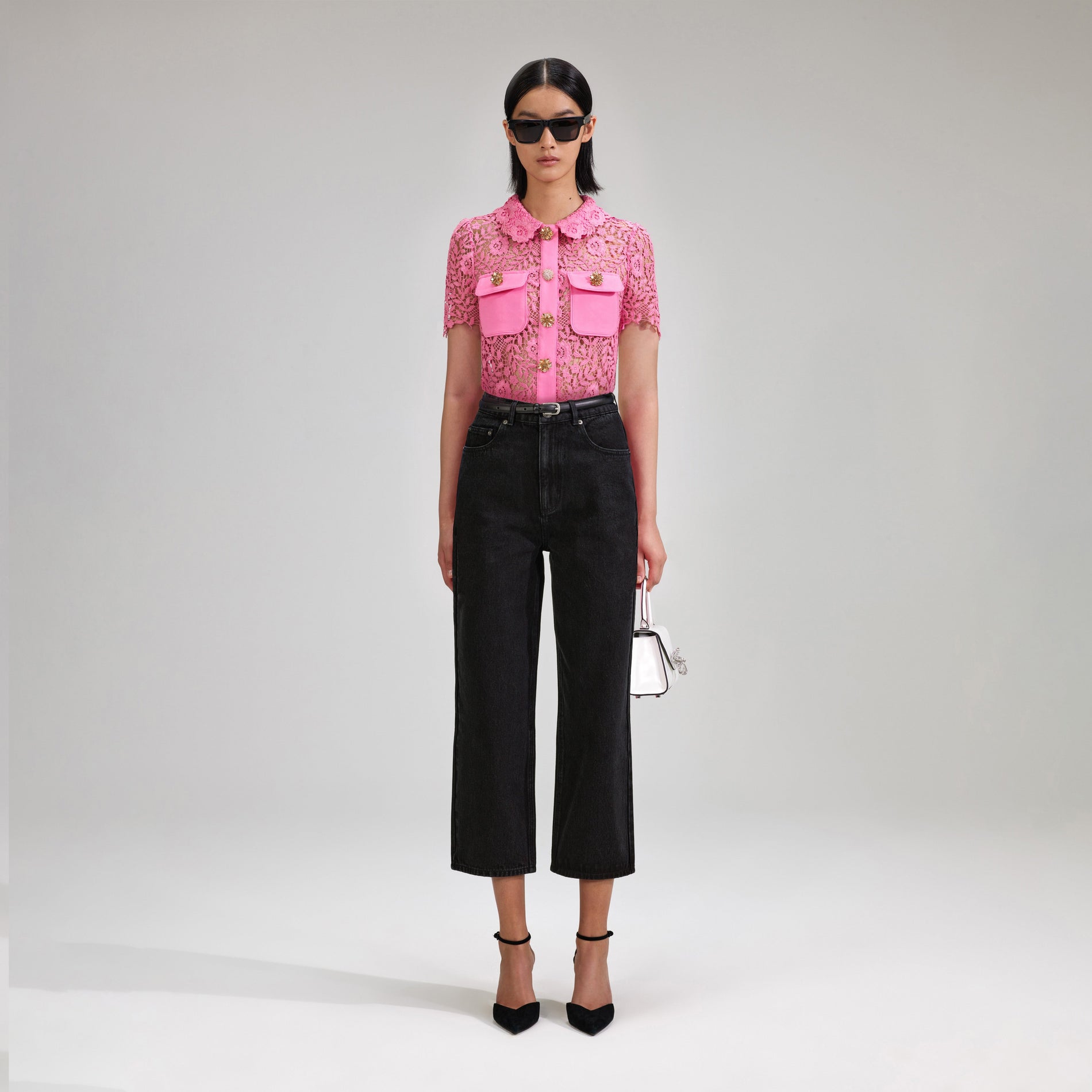 A woman wearing the Pink Rose Lace Top