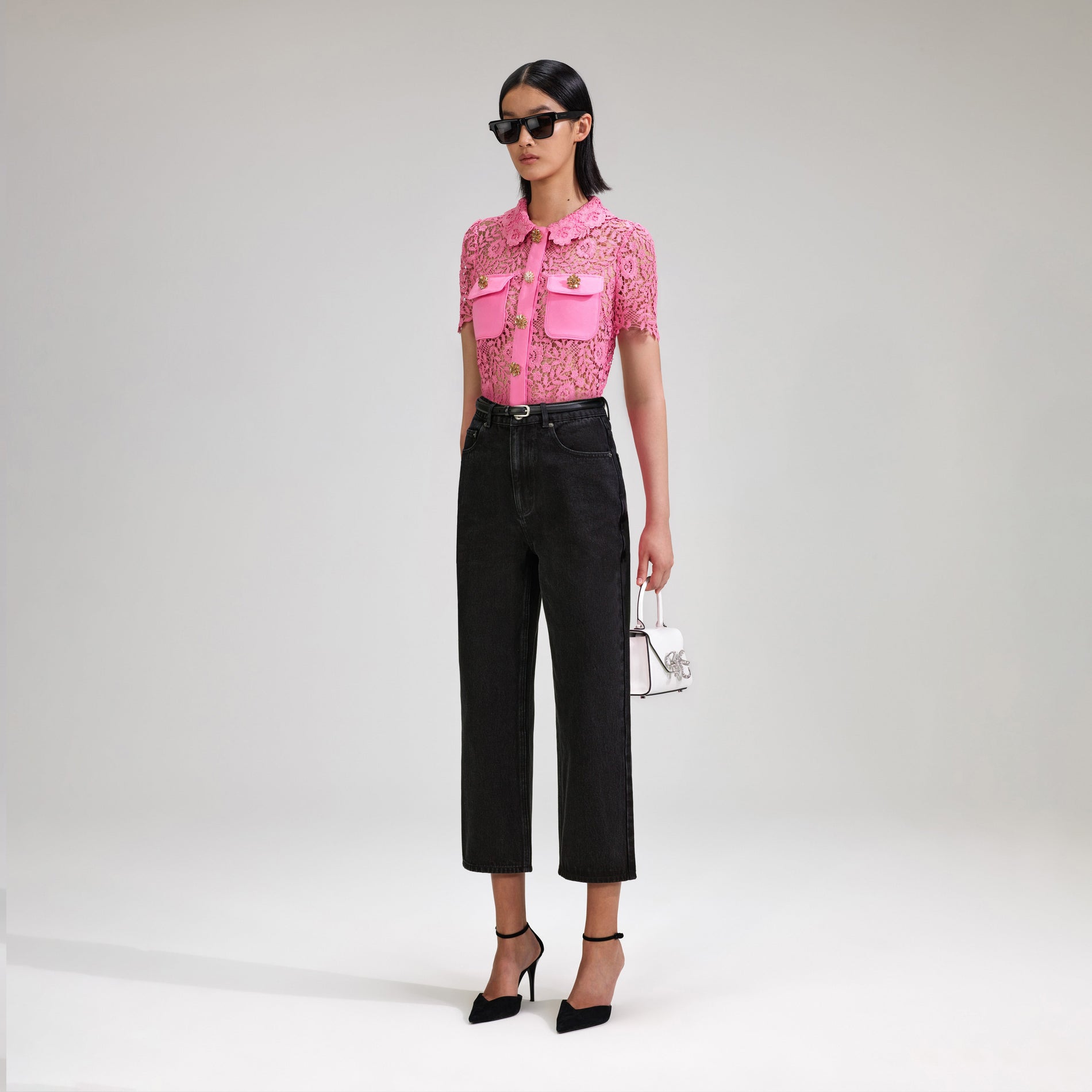 A woman wearing the Pink Rose Lace Top