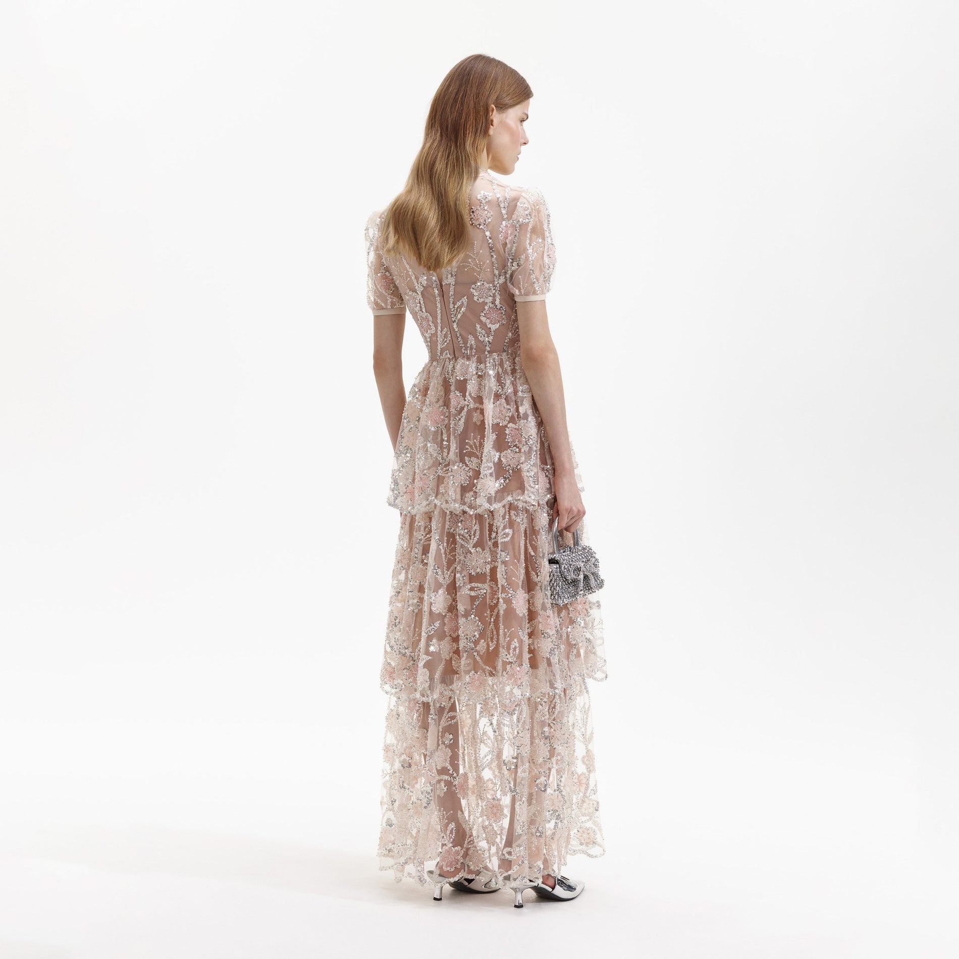 Back view of a woman wearing the Sequin Flower Maxi Dress