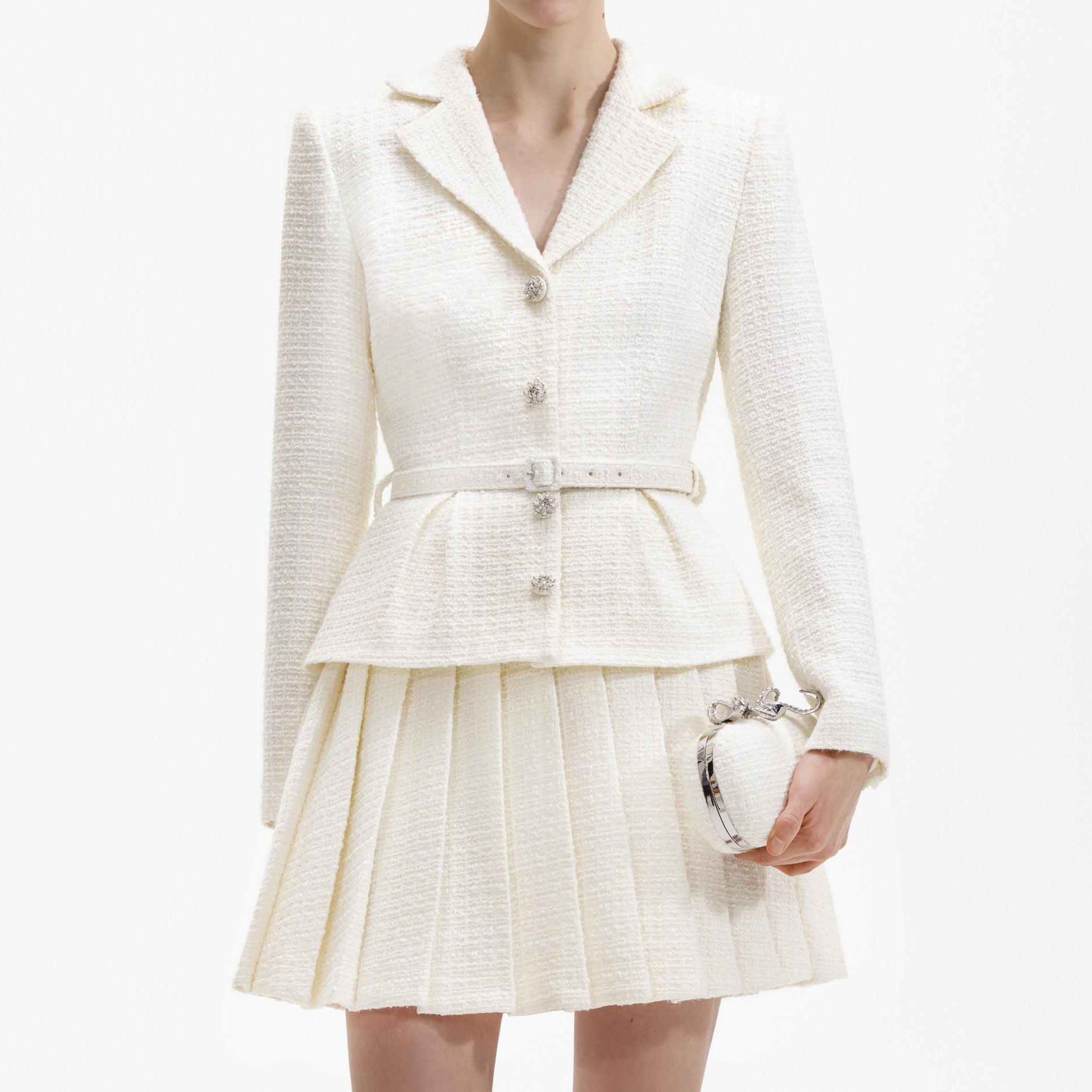 A close up of a woman wearing the Cream Boucle Mini Jacket Dress