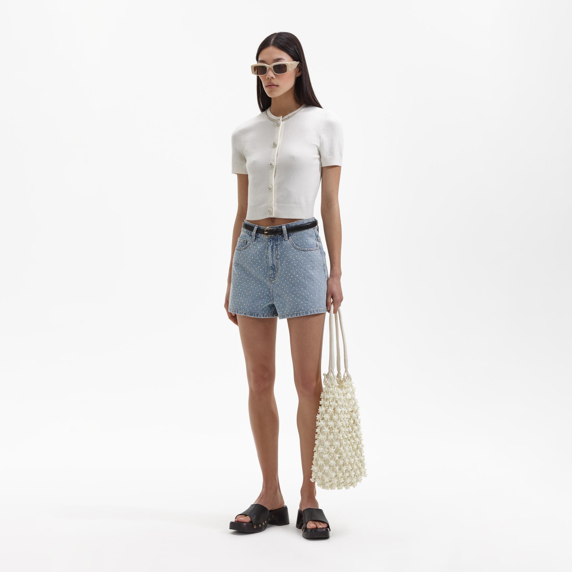 Side view of a woman wearing the Rhinestone Denim Regular Shorts