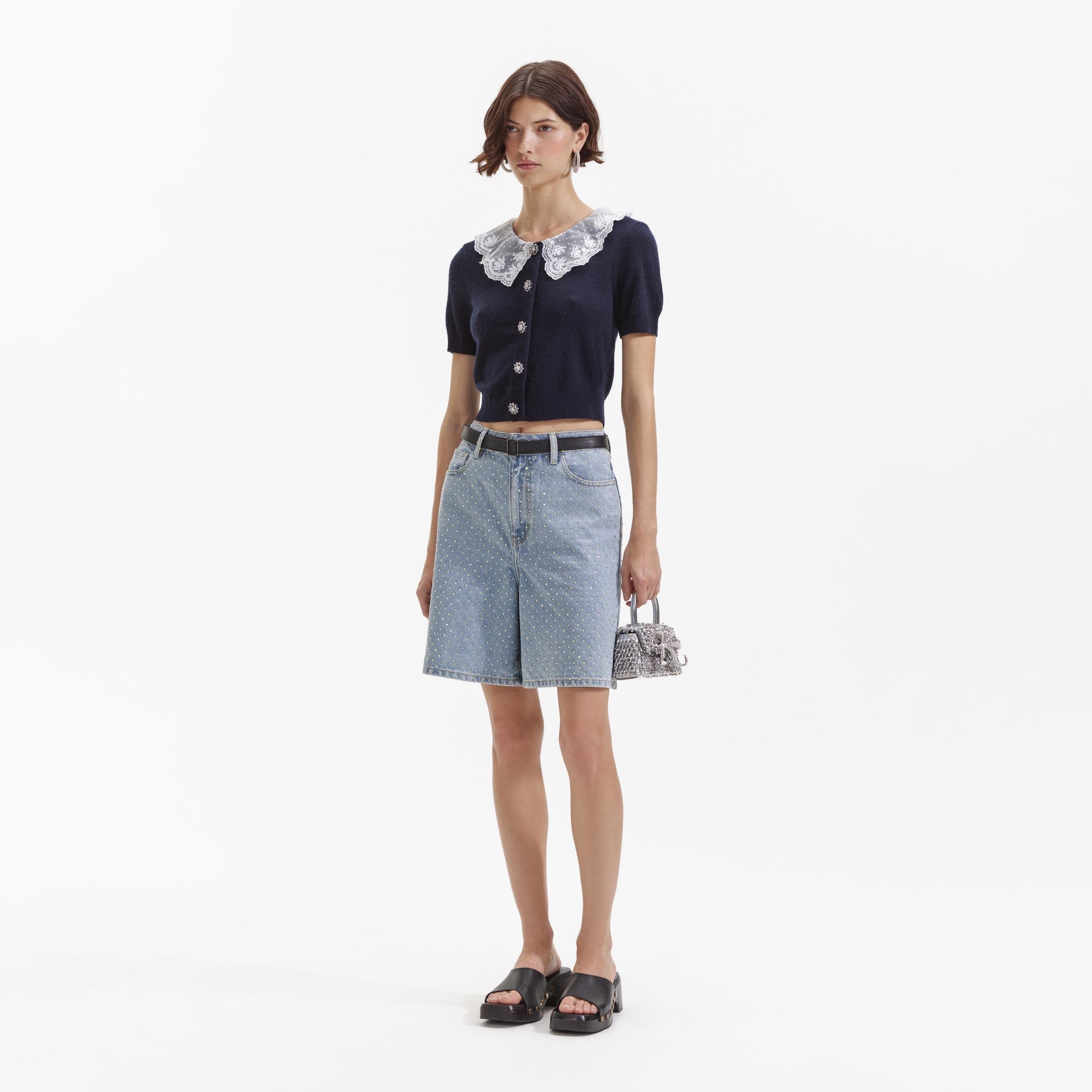 Side view of a woman wearing the Navy Cashmere Blend Collar Cardigan