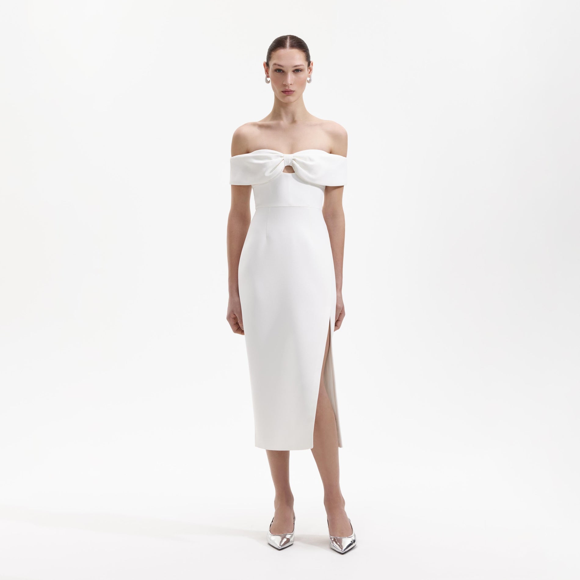 Front view of a woman wearing the White Crepe Bow Midi Dress