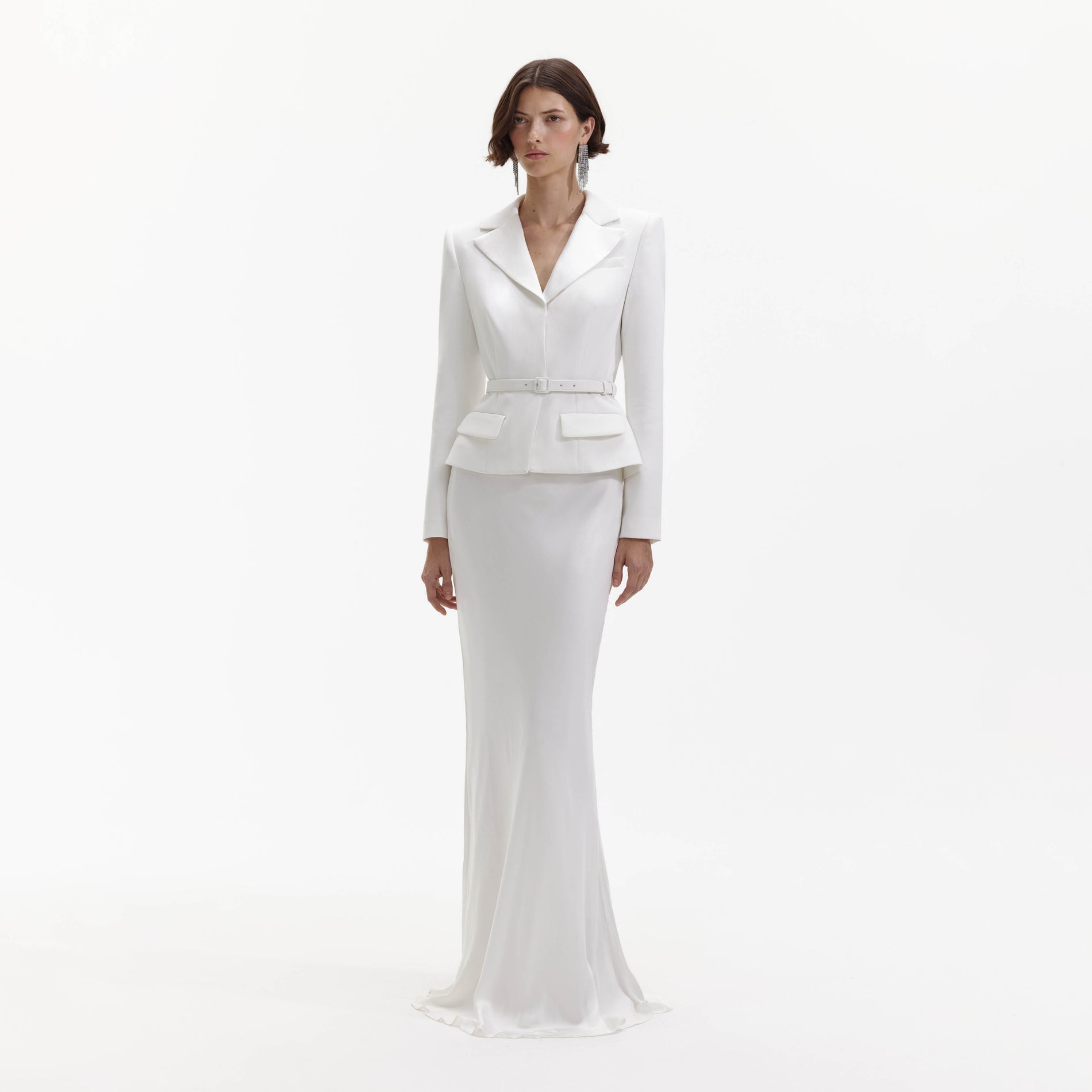 Side view of a woman wearing the White Crepe Tailored Maxi Dress