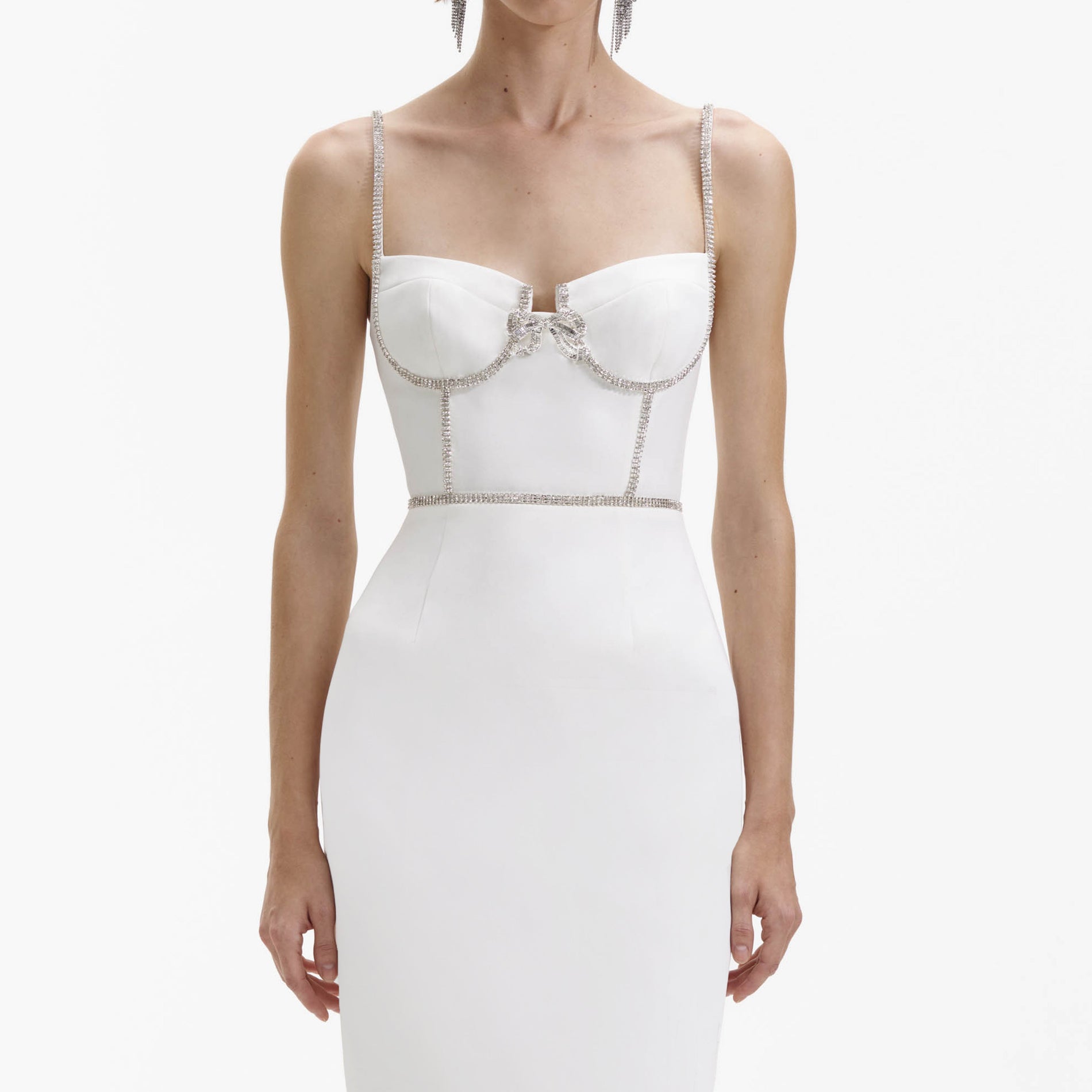 A close up of a woman wearing the White Bonded Crepe Midi Dress