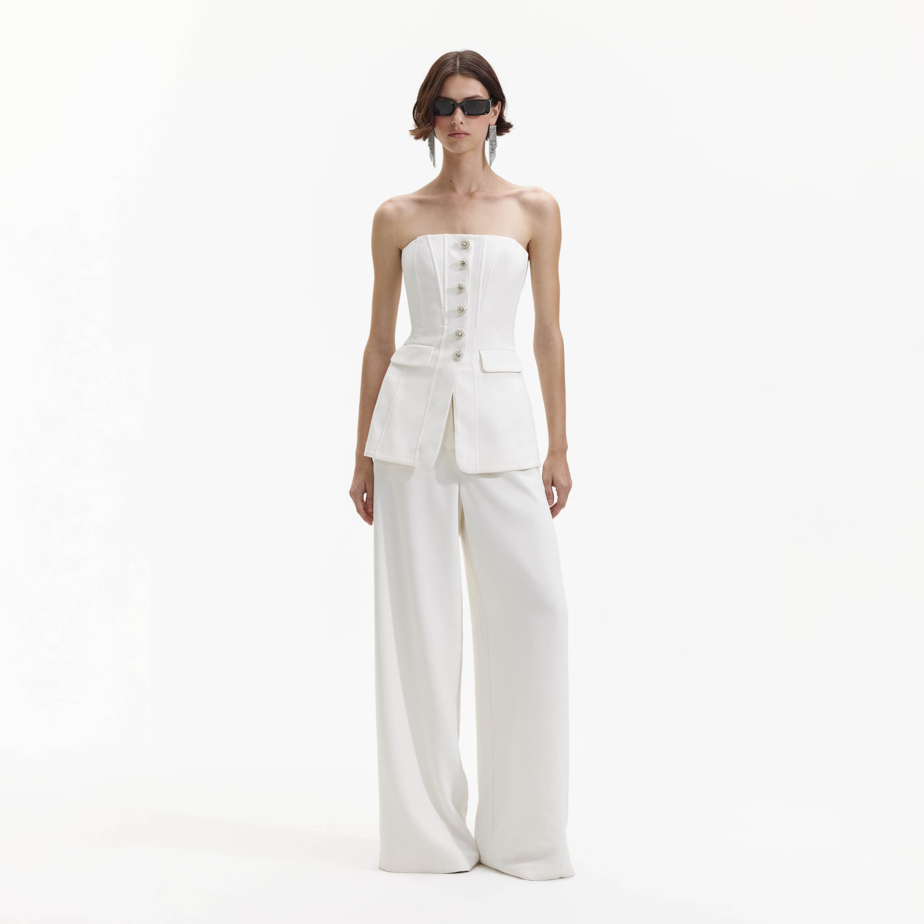 Front view of a woman wearing the White Bandeau Crepe Jumpsuit