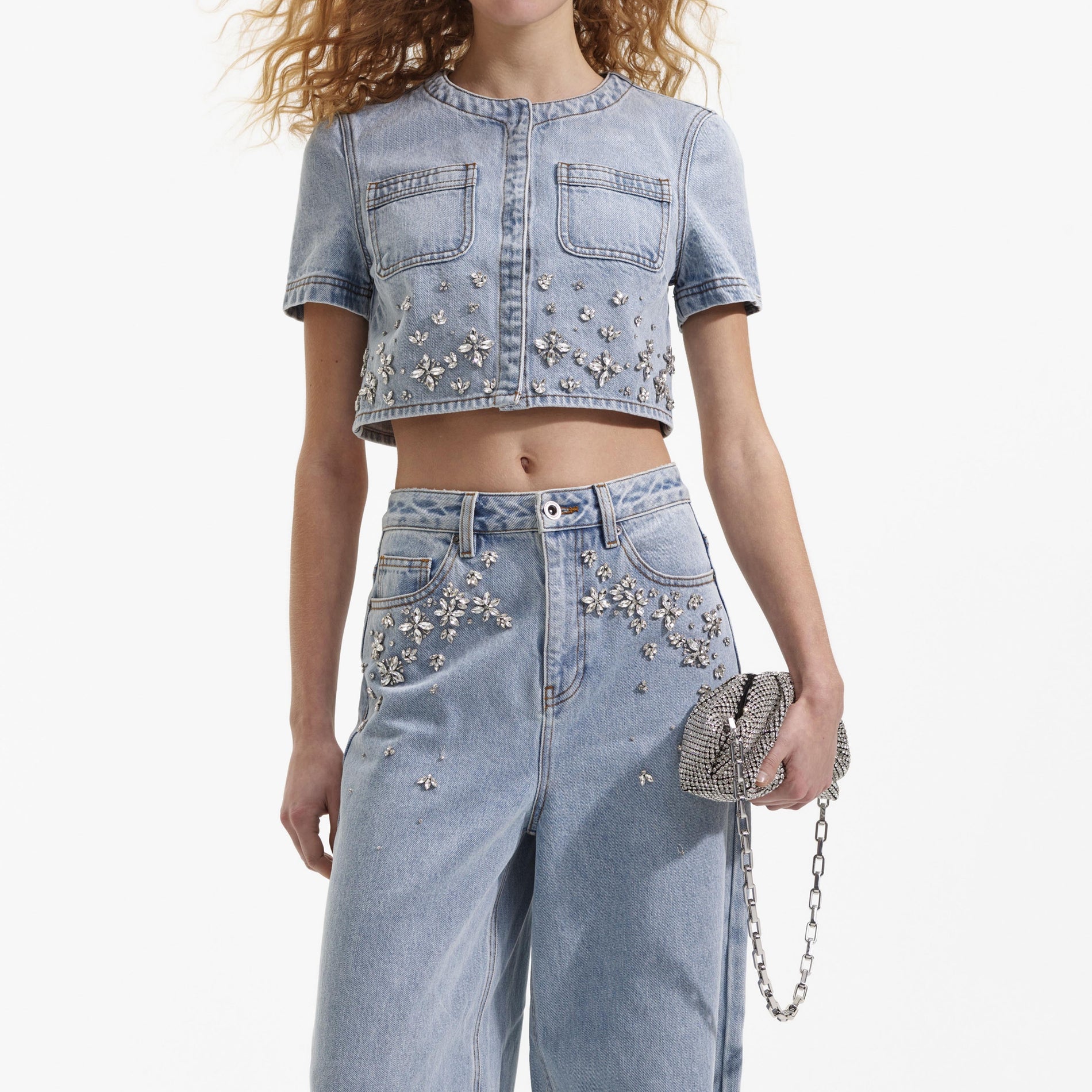 A close up of a woman wearing the Blue Embellished Jeans