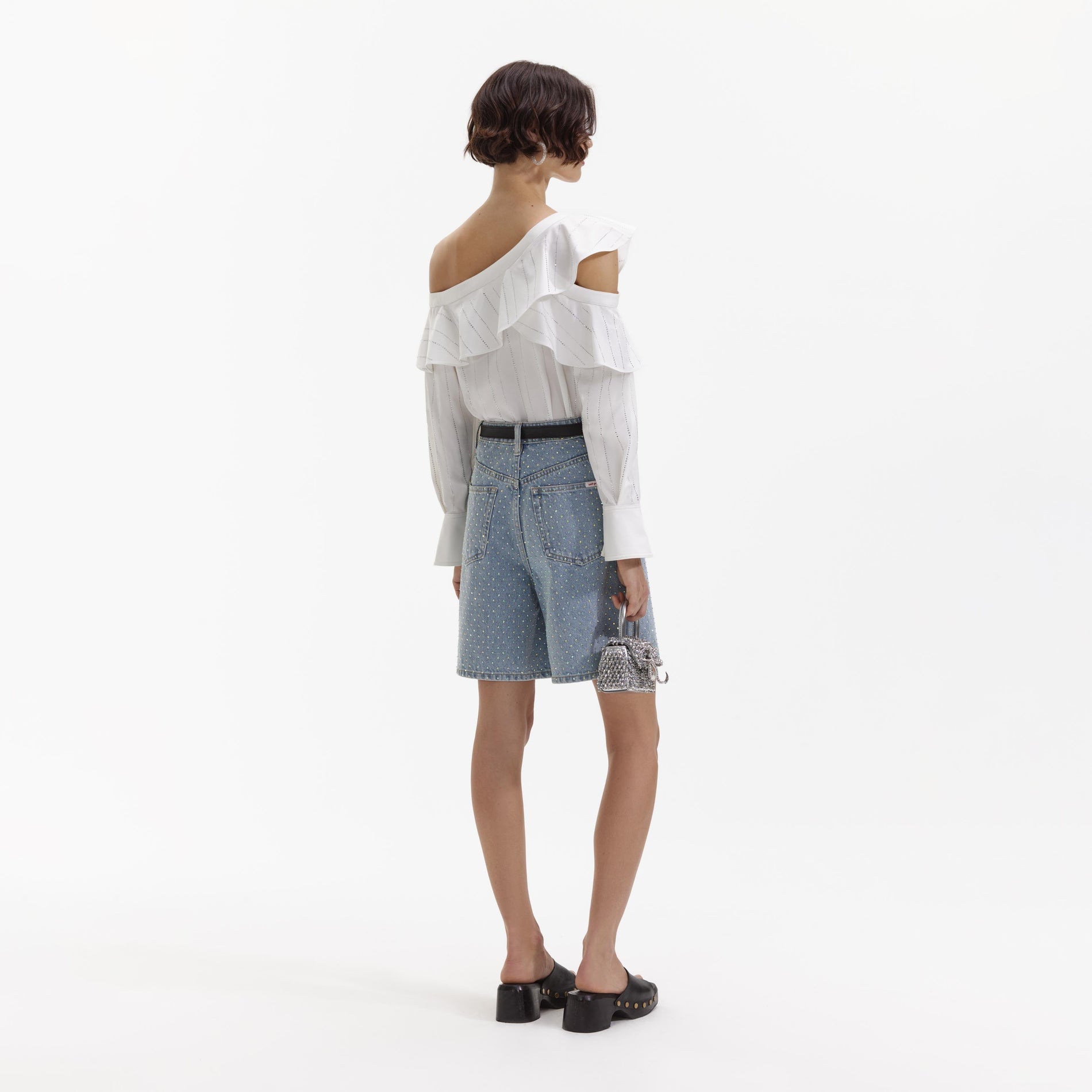 A Woman wearing the Rhinestone Denim Shorts