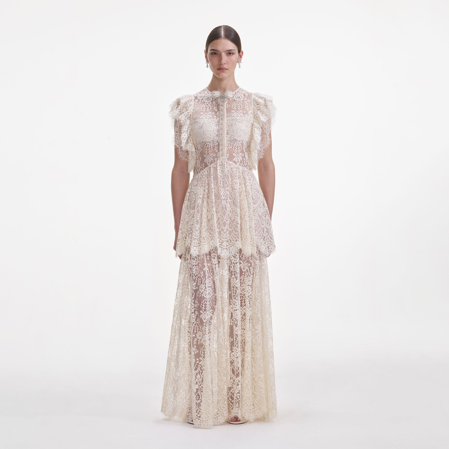 Front view of a woman wearing the White Tiered Lace Maxi Dress