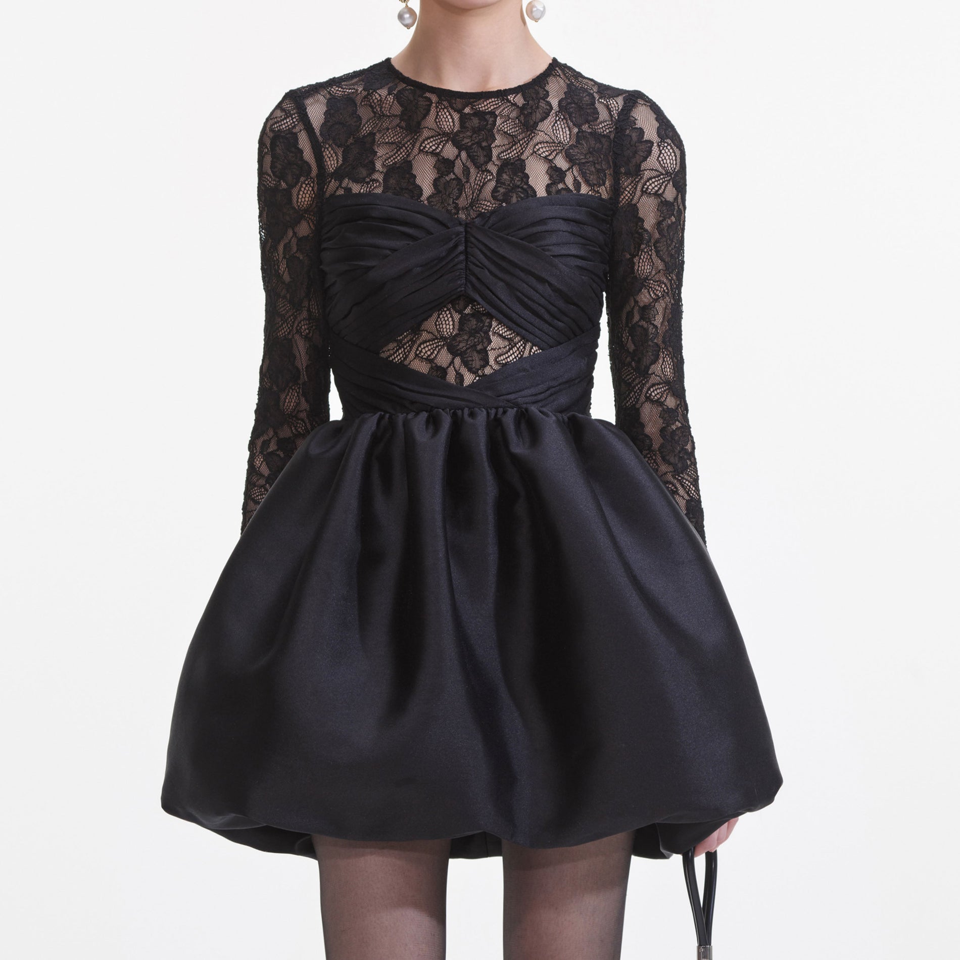 A close up of a woman wearing the Black Taffeta Lace Mini Dress