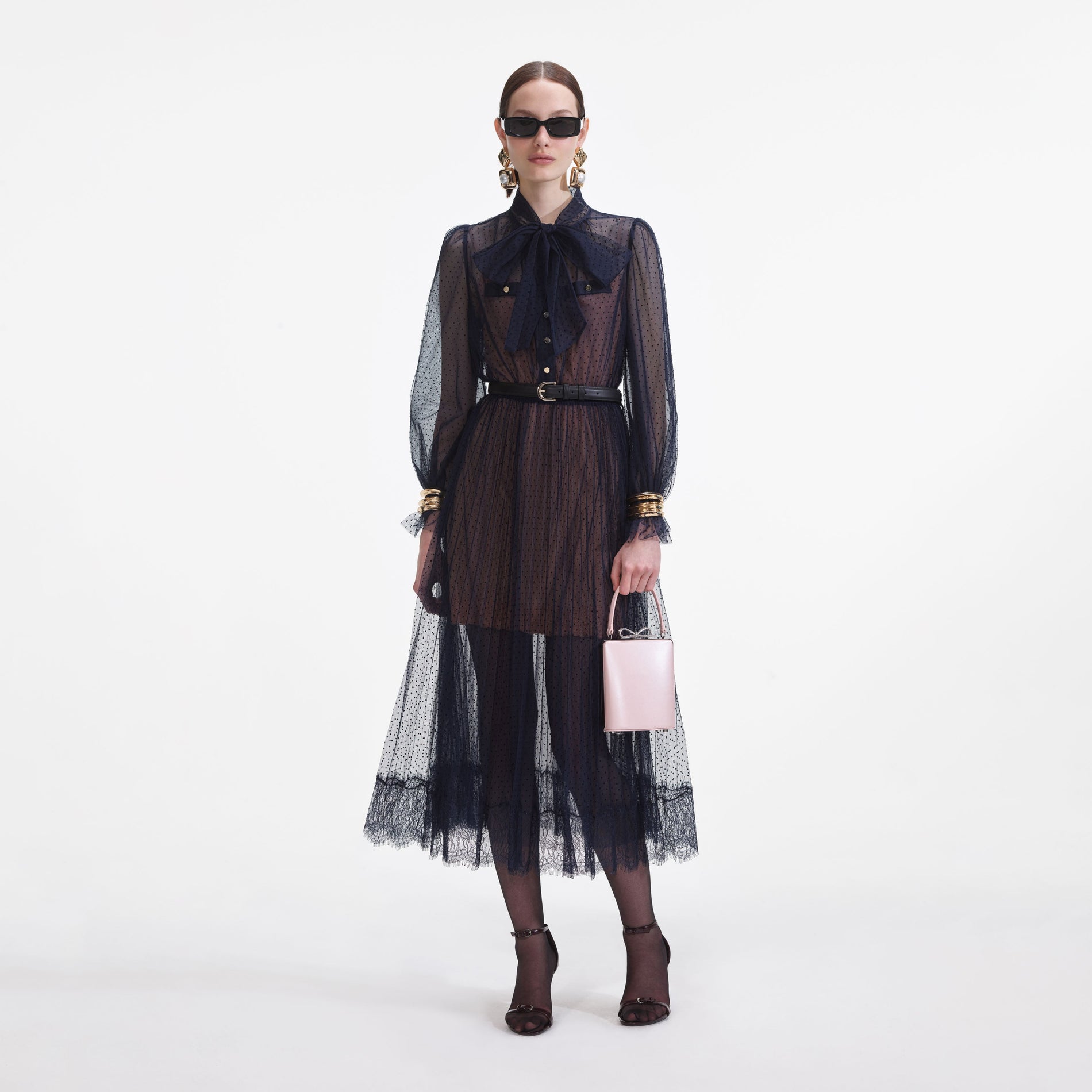 Front view of a woman wearing the Navy Dot Mesh Midi Dress