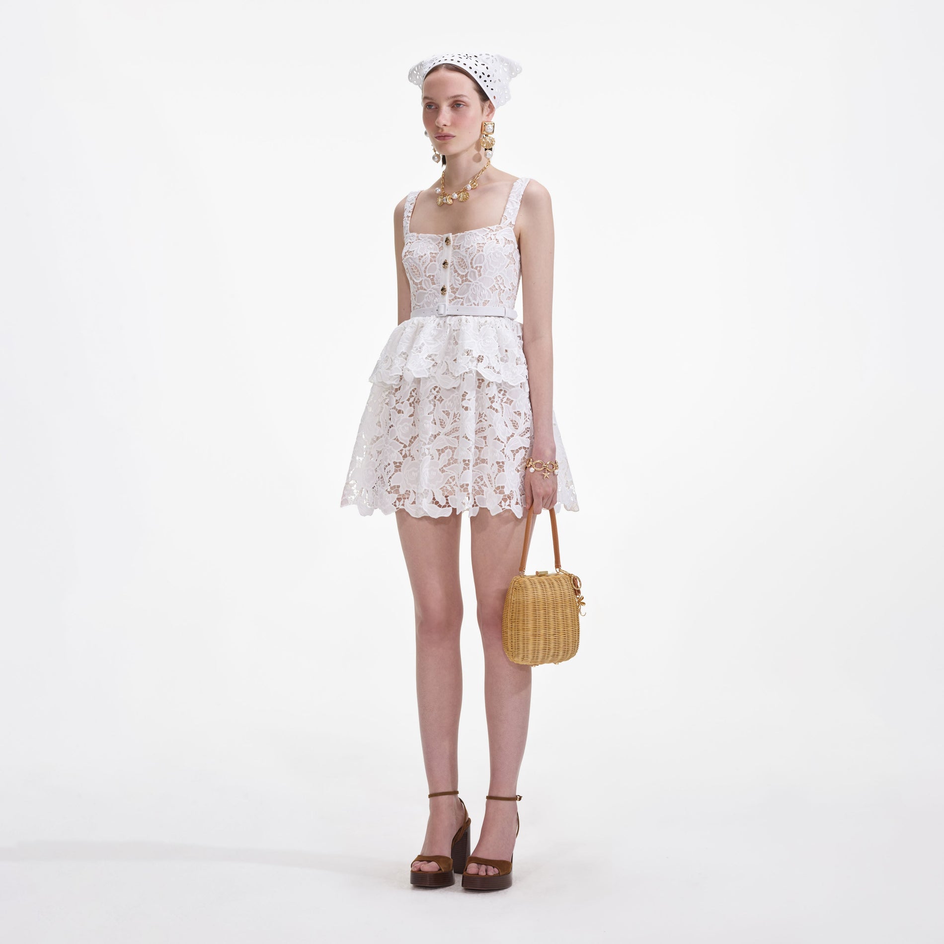 Side view of a woman wearing the White Lace Tiered Mini Dress