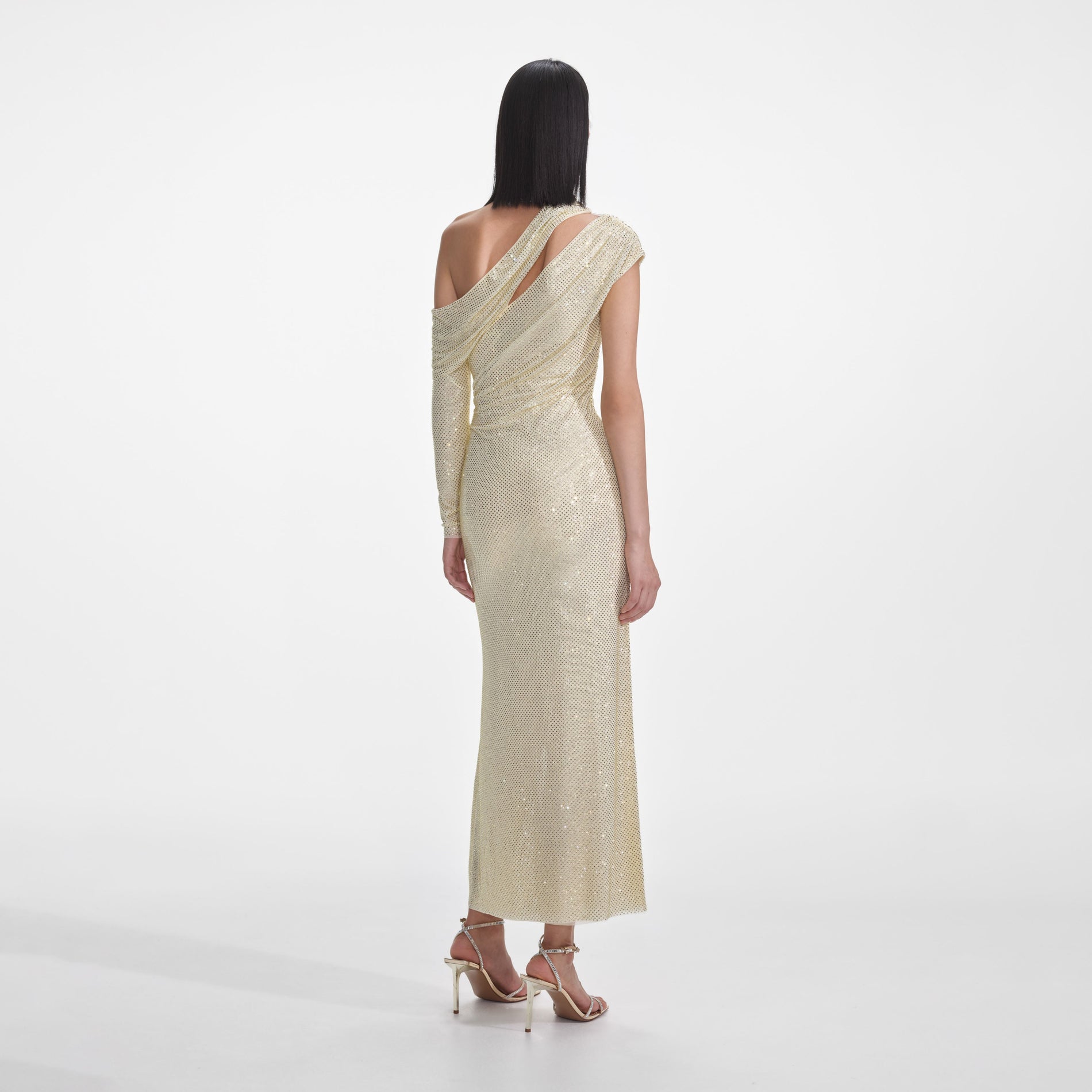 Back view of a woman wearing the Yellow Rhinestone Gathered Midi Dress