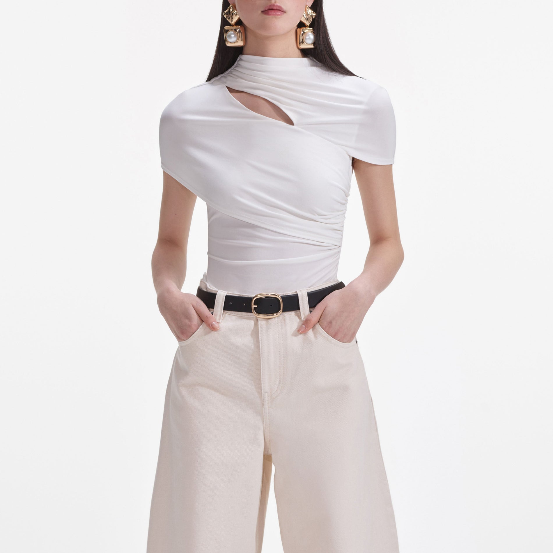 A close up of a woman wearing the Cream Jersey Gathered Top