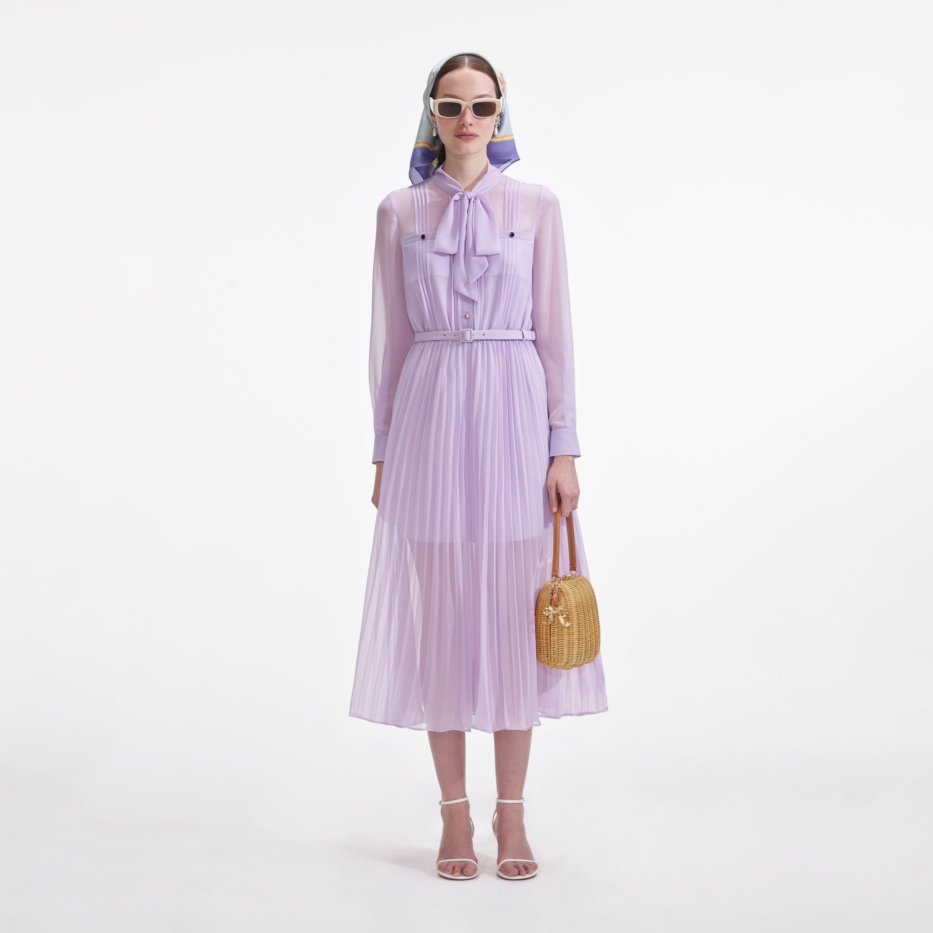 Front view of a woman wearing the Lilac Chiffon Pussy Bow Midi Dress