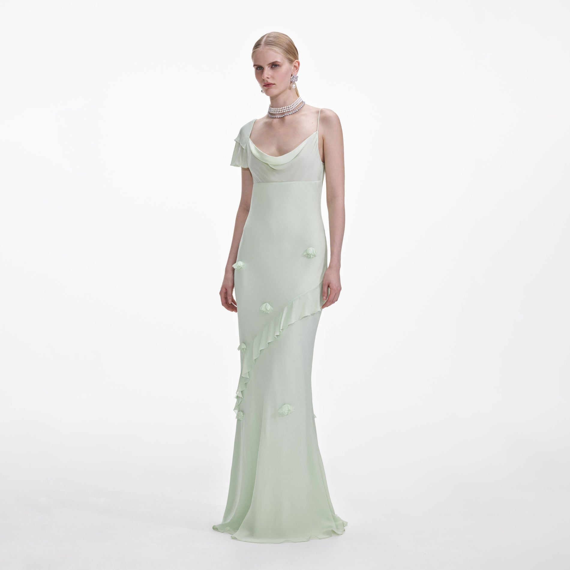 Side view of a woman wearing the Mint Georgette Flower Maxi Dress