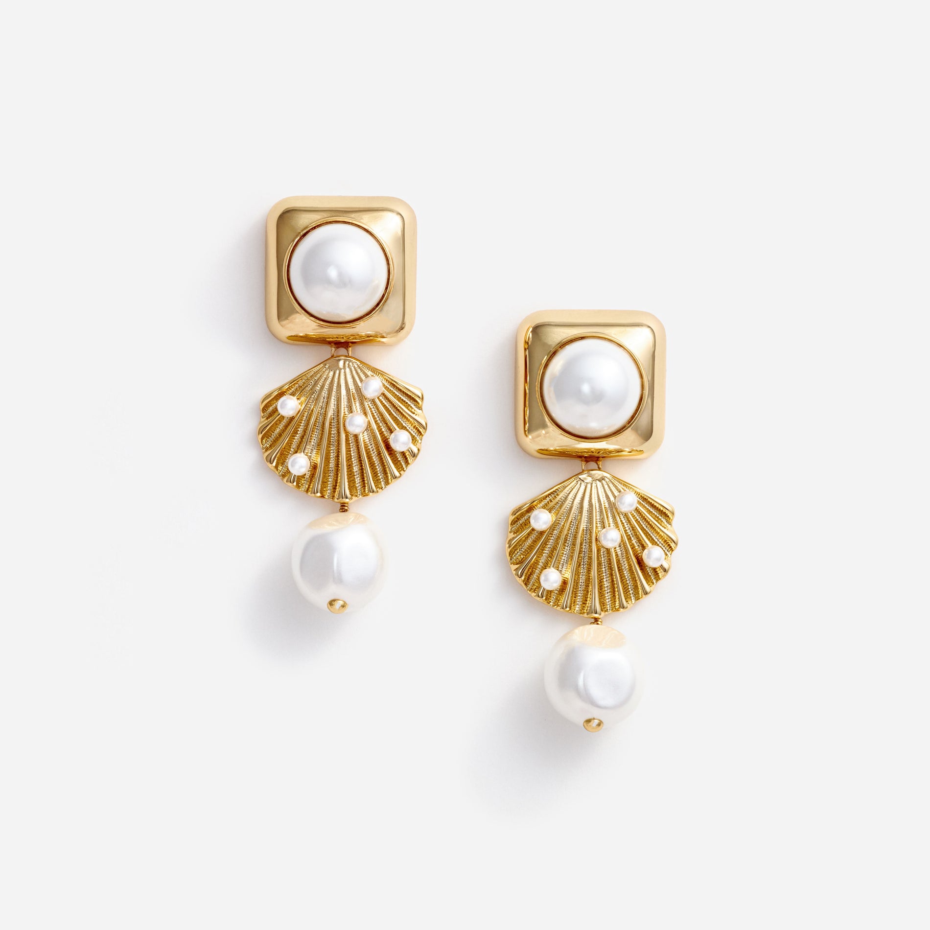 A photo of the Gold Pearl Shell Earrings