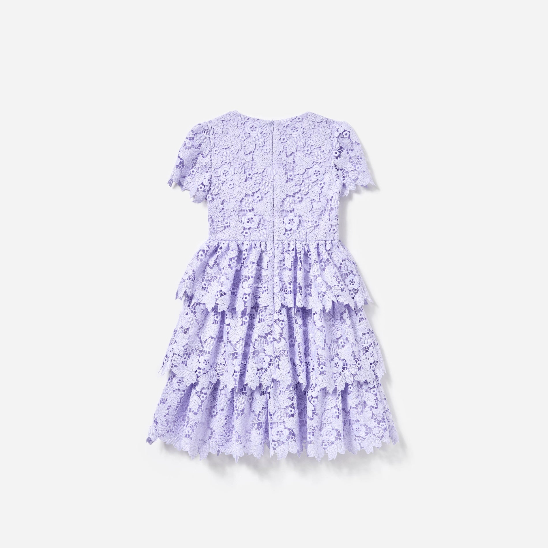 Side view of a woman wearing the Lilac Butterfly Lace Dress