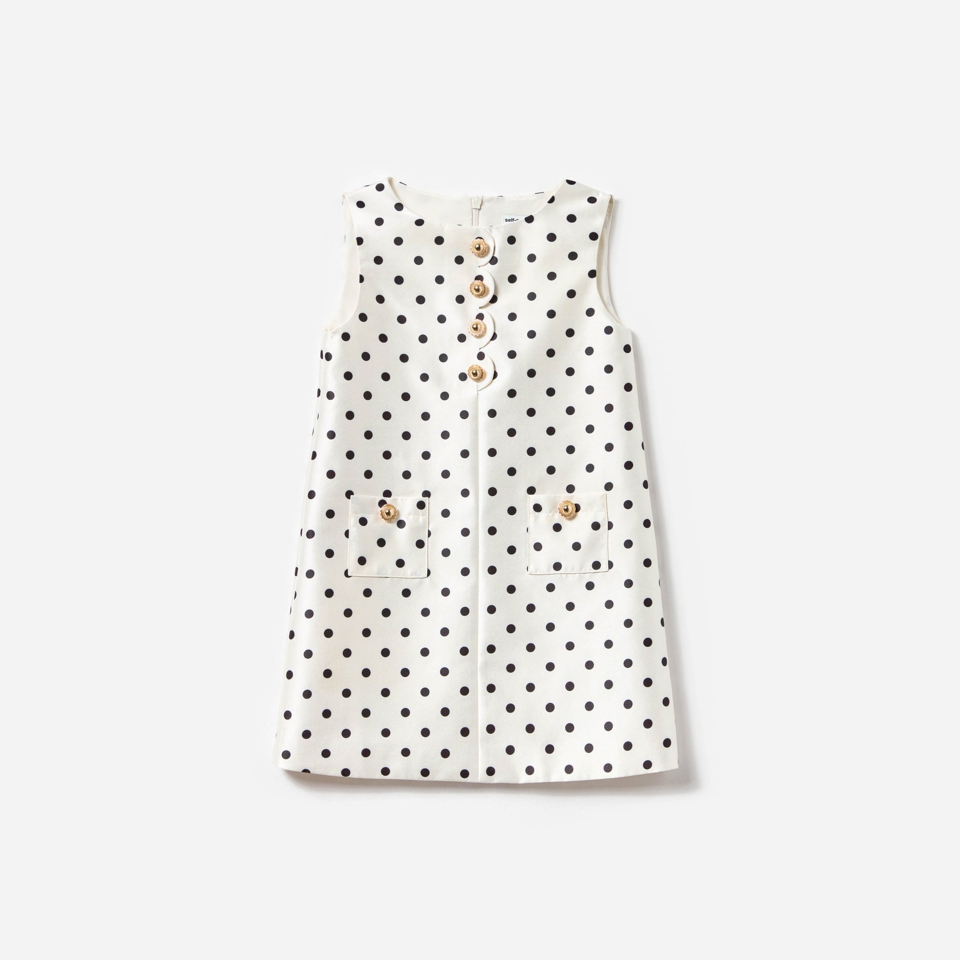 Front view of a woman wearing the Cream Sleeveless Polka Dot Taffeta Dress