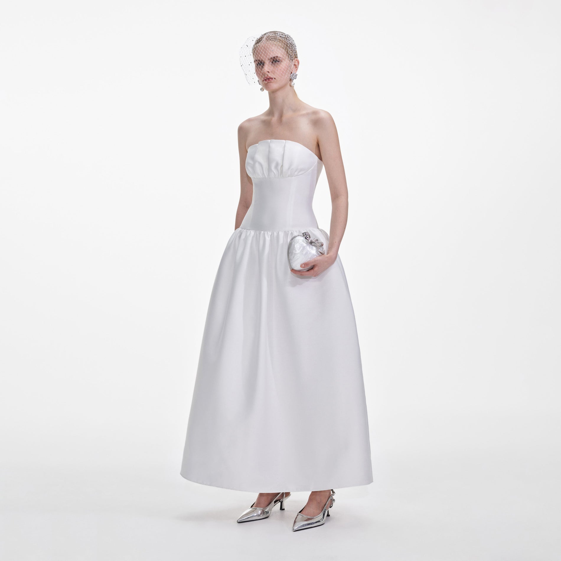 Side view of a woman wearing the White Taffeta Maxi Dress