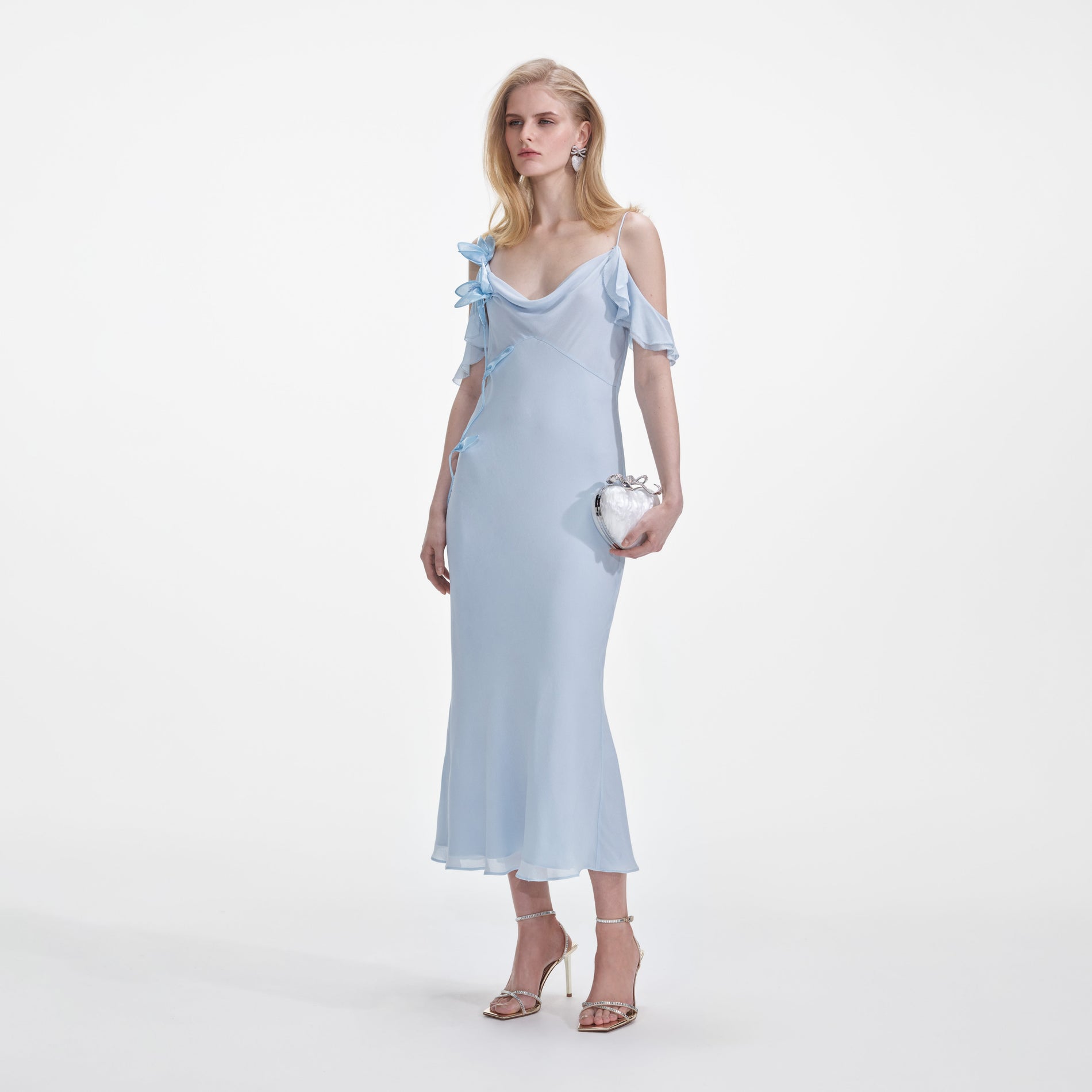 Side view of a woman wearing the Blue Georgette Flower Midi Dress