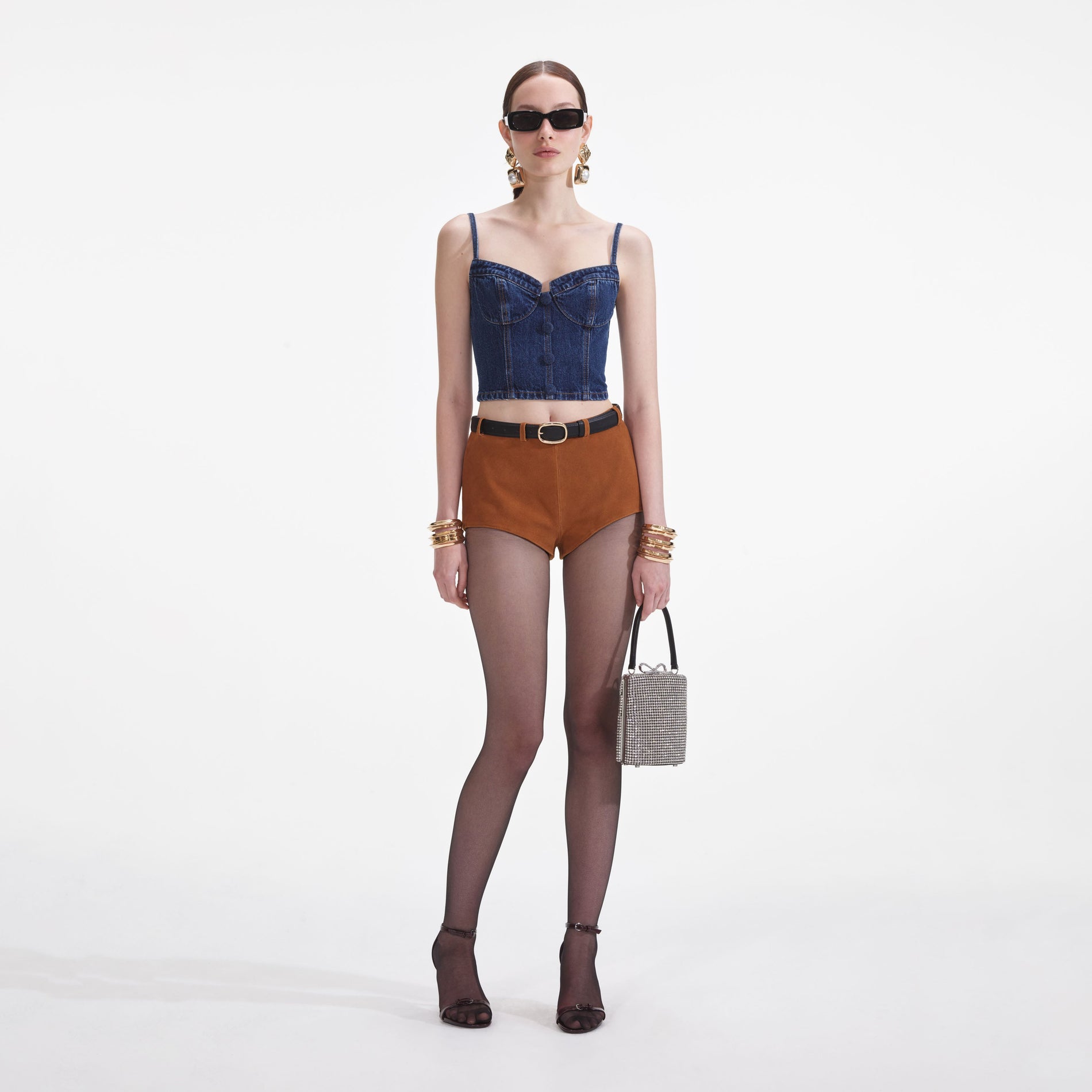 Front view of a woman wearing the Denim Strappy Top