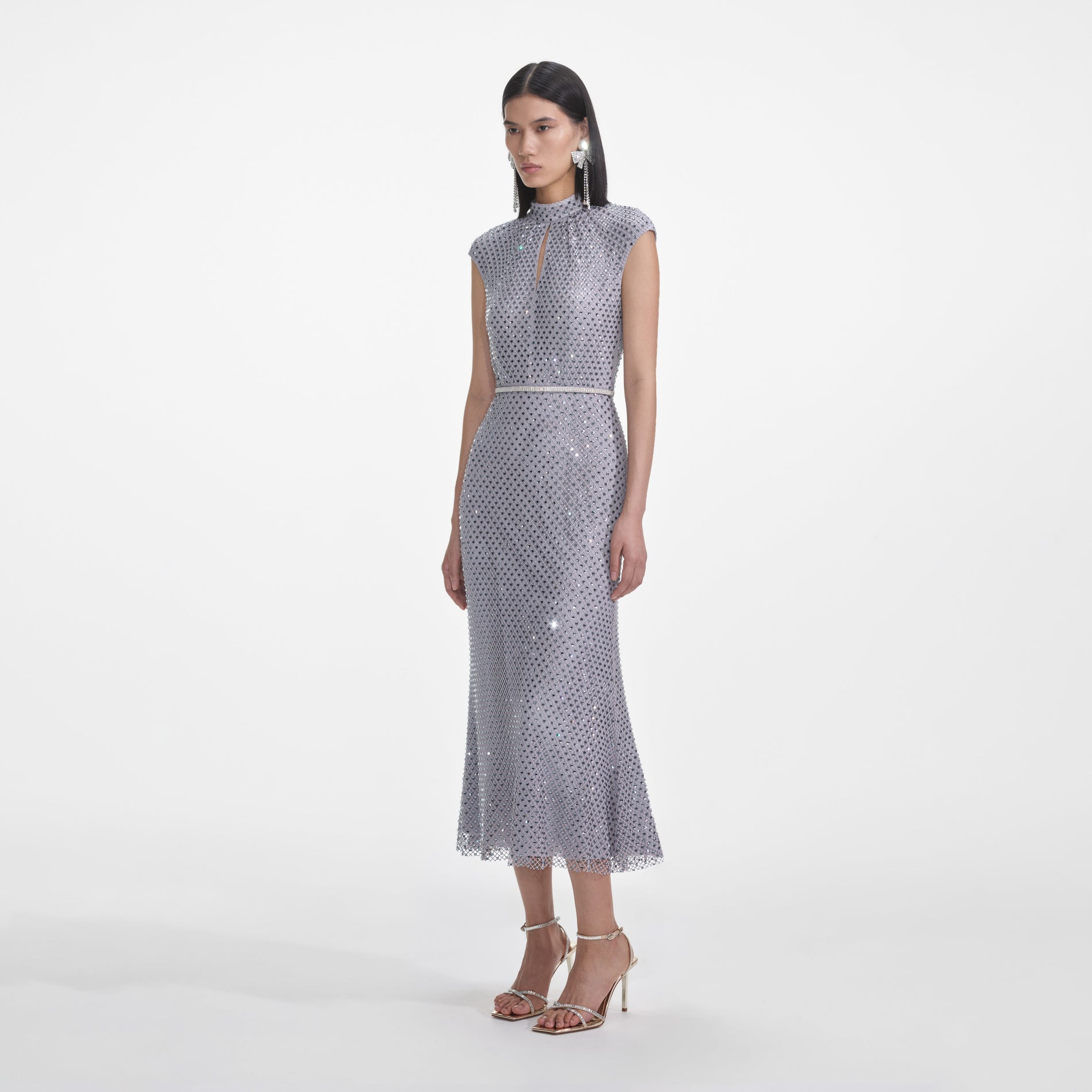 Side view of a woman wearing the Grey Rhinestone Fishnet Midi Dress