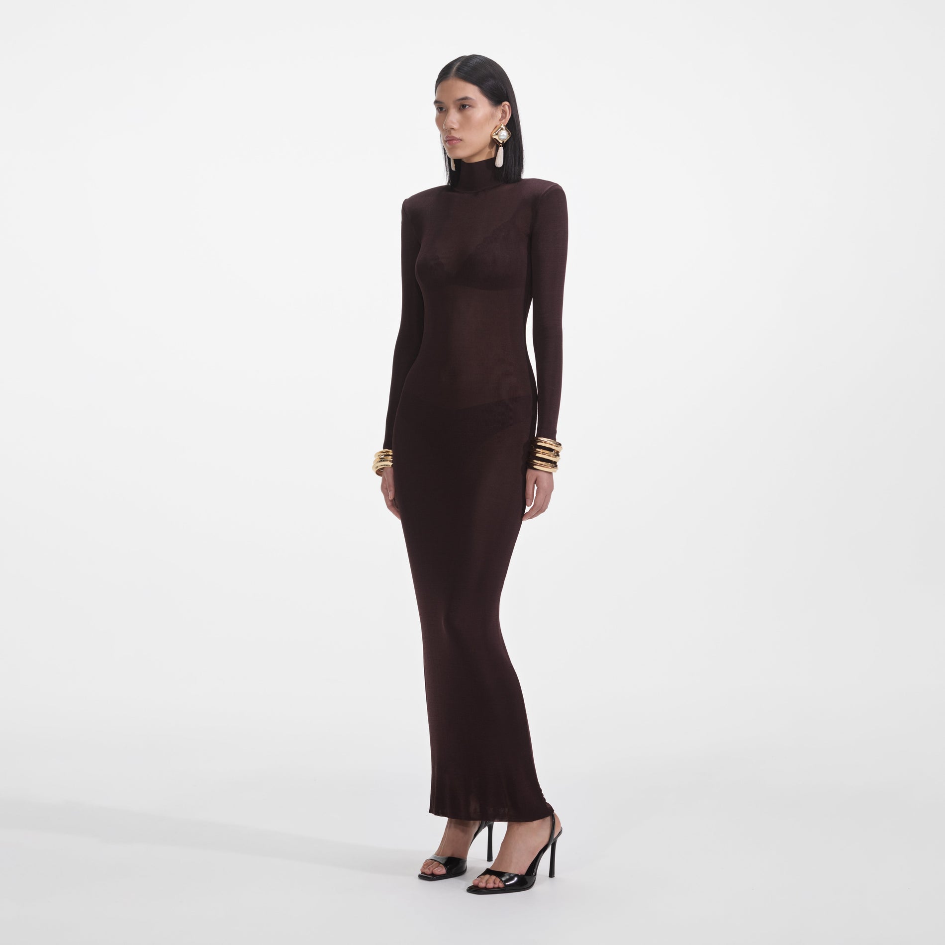Side view of a woman wearing the Brown Viscose Knit Maxi Dress