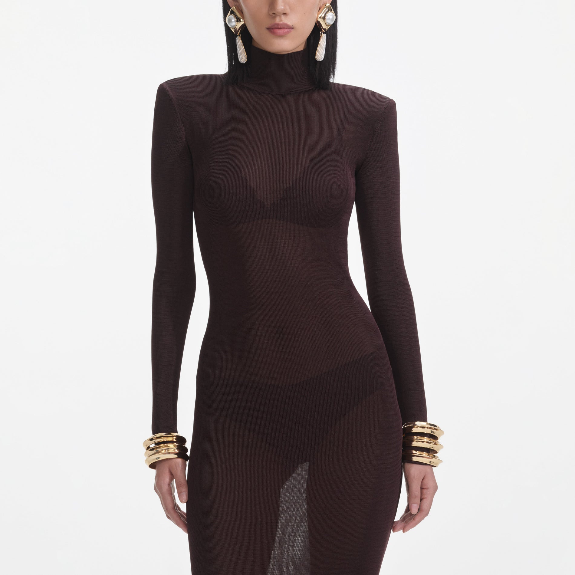 A close up of a woman wearing the Brown Viscose Knit Maxi Dress